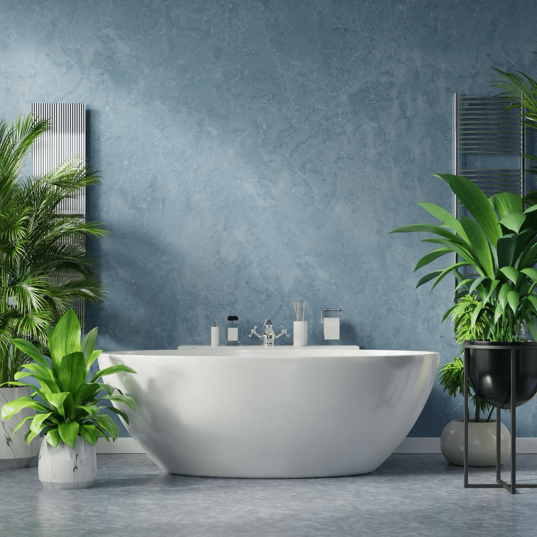 A bathroom with a tub and potted plants Description automatically generated