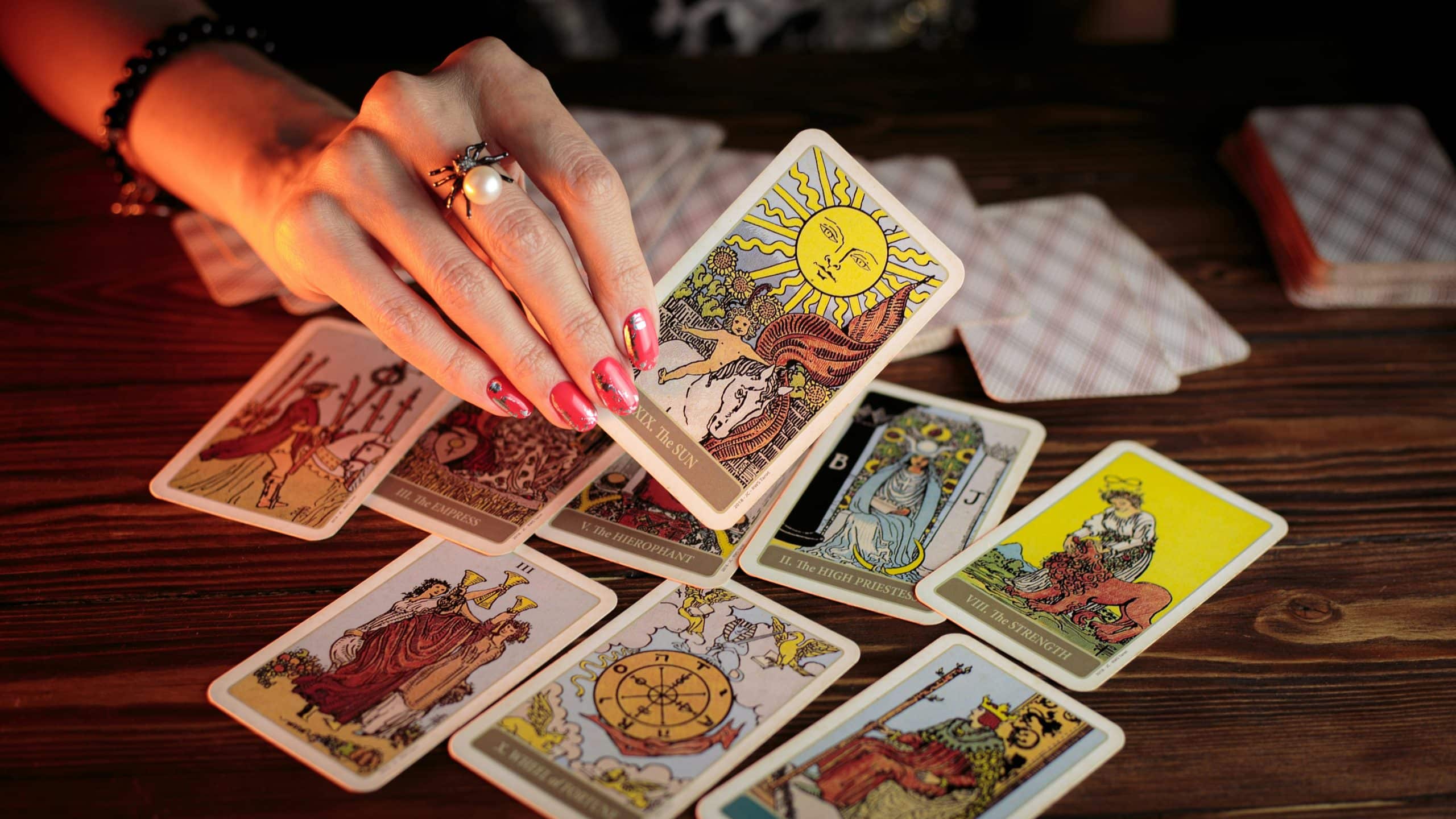 As a rule, people consider tarot an instrument used to predict the future. But the trick is that there’s more to it! Tarot is a powerful tool that helps take your mental and emotional wellness to the next level. More and more people all over the globe discover the wonderful universe of tarot, making it their trustworthy companion for healing, self-reflection, and inner growth. Ready to start your mental health journey? If you make sure to approach the deck mindfully, you’ll connect with your emotions, bring clarity to your thoughts, and take care of your mental well-being in a (very!) gentle way.

Ready to start? Here’s how tarot cards can assist you with that.

The Cards Provide Space for Self-Reflection

Time flies, and sometimes it feels like life’s moving so fast that you can’t even notice what you really feel. Or, you simply ignore it because, well, there’s no time. With the help of in-person or online tarot reading from top experts, you can (finally!) pause and ask yourself, “What is it that is really going on inside me?” A simple daily ritual of drawing a single card can provide you with a symbolic and visual hint on what your true emotions are like and what challenges your inner self is currently combating.

Did you just pull The Hermit card? It signals quiet contemplation. Or, perhaps, it’s The Moon? Chances are, the time to explore your inner fears has come. These symbols can reveal hidden feelings or offer fresh insights you hadn’t looked at before.

Tarot Is a Great Helper When It’s Time to Process Tough Emotions

In tough times, we all need a shoulder to cry on. Why not let a card serve as a good and loyal friend who will never judge? Whether you’re feeling anxious, overwhelmed, or sad, tarot provides a space where nobody judges you. Instead, you are free to explore what’s coming up. If you hope for direct answers, don’t. What cards can do is help you ask better questions, such as:

What is the main cause of the stress I’m stuck in now?
What part of me needs the most support right now?
How can I deal with this situation with the maximum kindness?

In other words, tarot never inspires you to avoid pain and pretend like everything’s fine. It encourages you to meet your fears and challenges tête-à-tête while being curious, kind, and compassionate to your inner self.

Tarot Helps You Become More Mindful

After all, every other reading séance is a mindful ritual. You take the deck and shuffle it slowly. You breathe in and breathe out deeply. You focus your attention on the question you have in mind and the process of shuffling. This in itself can be calming. When you turn your intuition on, you focus on the process in the moment (here and now) and naturally enter a fully aware mental state. Once the card is pulled, take your time to reflect on it and do not hesitate to write down your reflections in a journal. Don’t have a journal? Get one! The peaceful and relaxing mindful pause in an extra-busy routine is your path to clarity and healing.

You Reveal Patterns and Recognize Cycles

Sometimes we get stuck in repetitive thought loops or the most various self-sabotaging patterns. That’s when tarot can help you get out of this never-ending whirlpool of emotions. The good old deck can help you recognize all those patterns and combat them like an ace. For example, if cards related to lack of boundaries seem to be pulled again and again (and again!), chances are the spirits want to tell you that you have to re-evaluate how you’re managing your time and energy. In other words, look at the tarot cards as if you’re looking into a mirror that reflects what’s going on with your inner self. As a result, you will finally be able to say goodbye to old narratives (that you are so tired of) and build new ones that are healthier.

Cards Remind You That You Are Strong

Don’t think that tarot can only show you challenges! In addition to the negative things that cards help you detect, they can also remind you of your strengths. Cards like Strength, The Star, or The Sun are the signals of resilience, hope, and positivity. A great number of practitioners and amateurs tend to use these empowering cards as ‘guiding stars’ in their routine and emotional boosters. The truth is that only seeing those images and messages can help you boost your confidence, cultivate self-love, and finally find peace, even if the world seems to fall apart.

Your Learn to Set Emotional Boundaries

By using tarot to ‘get in touch’ with your inner self, you finally realize what your emotional needs are. When having better awareness of those, you find it easier to set boundaries. You finally learn to say NO when needed and prioritize yourself. You learn to recognize what drains or restores your energy. Of course, it’s not about turning into a selfish person. Instead, you clearly see what your inner world is full of, and with clarity comes the power to protect your peace.

Reading Sessions Support Personal Growth Over Time

As we’ve already mentioned above, getting a journal is a good idea. The point here is that if you get back to your notes time and again, you begin to notice how your thoughts and feelings evolve. You may start to see patterns of healing, how you grow personally compared to the times when you were totally broken, and recognize the traits of emotional and mental health transformation sooner or later. In other words, a simple deck of tarot cards becomes more than just a divination instrument. From now on, it's your faithful companion on your journey toward mental and emotional balance.

Be Kind to Yourself

Before you rush to cards and dive into the world of tarot, let us tell you one thing – not every reading séance is going to feel good. Some might feel like a disaster, and that is OK. Cards only reflect what’s happening inside, even the messy parts that you would choose to ignore. The key? Always be kind to yourself! Do you pull difficult cards? Perfect! Do not worry, but rather use it/them as starting points for curiosity, not one more reason to judge yourself. You’re not doing anything “wrong.” You are trying to face better days and use one of the most effective and time-tested tools for that. Finally, healing is a journey, and tarot is there to be your personal guide.