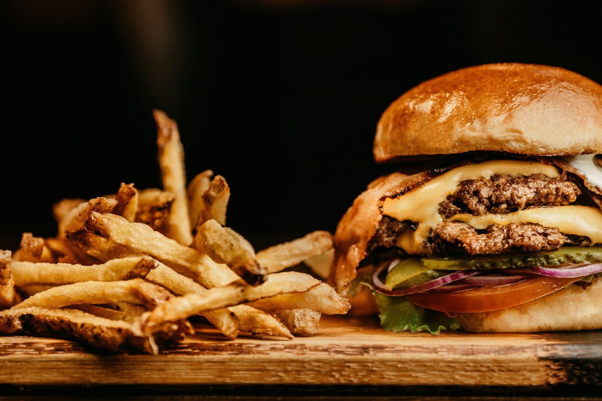 Packaged snacks and fast food are ultra-processed foods loaded with sugar, salt, fats, and preservatives.