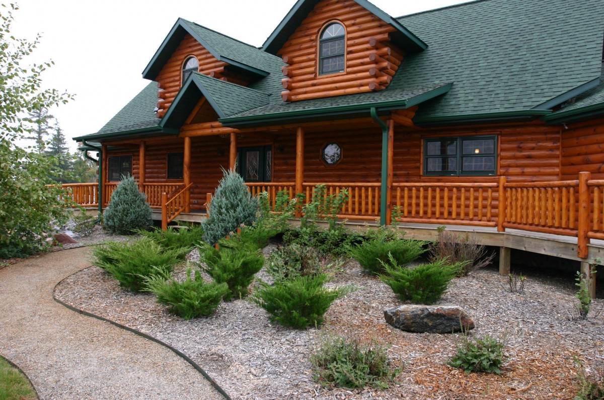 tree, structure, lawn, house, window, building, home, country, construction, log, cabin, cottage, backyard, residence, property, exterior, residential, garden, landscaping, wooden, comfort, timber, estate, log cabin, yard, siding, real estate, residential area, log home, outdoor structure