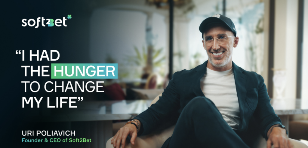Uri Poliavich, CEO of Soft2Bet, smiling with the quote "I had the hunger to change my life" – inspiring leadership in iGaming.