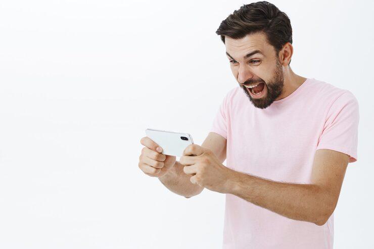 Expressive bearded man in pink Tshirt