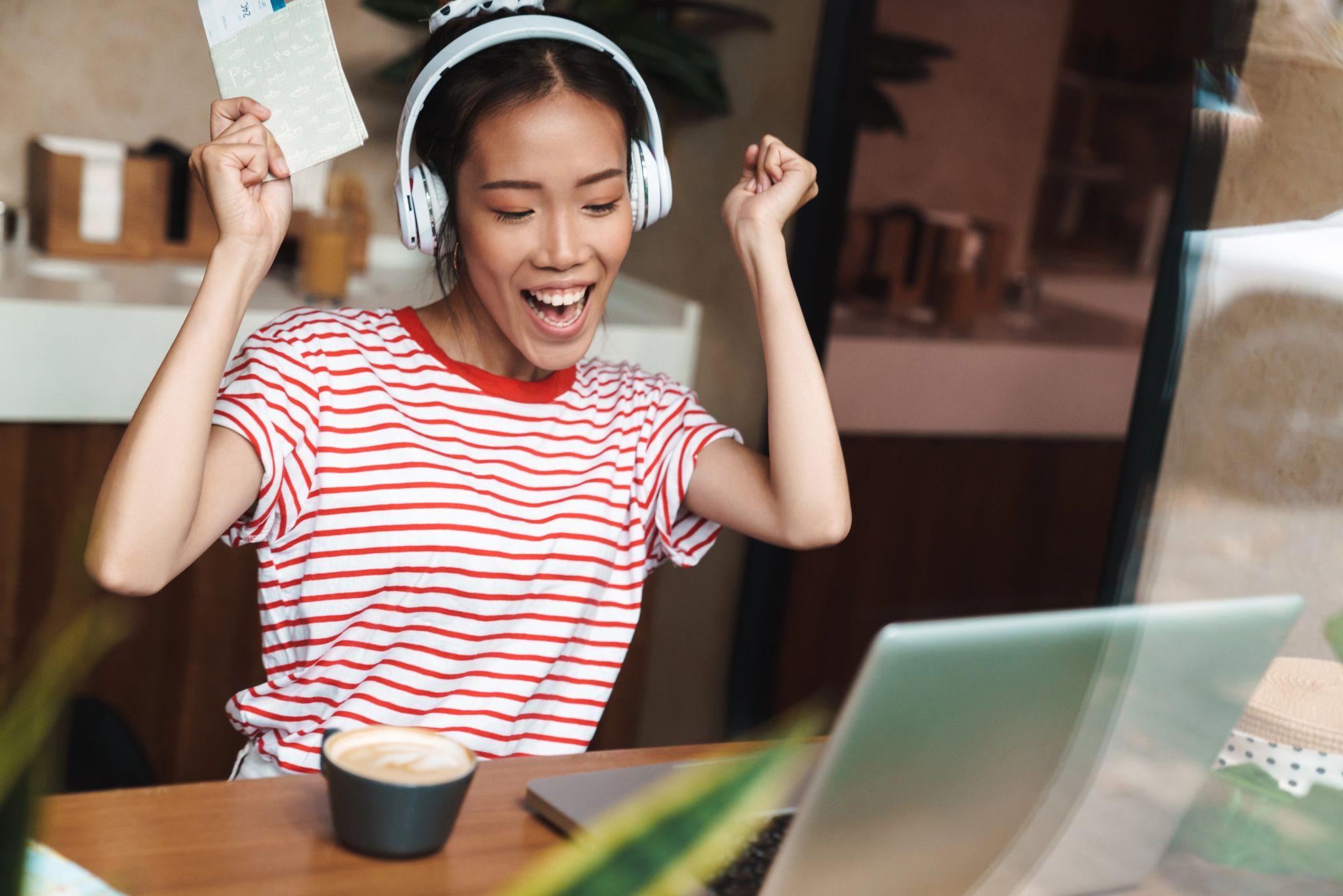 A young design expert listening to music while researching AI-assisted platforms for professional use