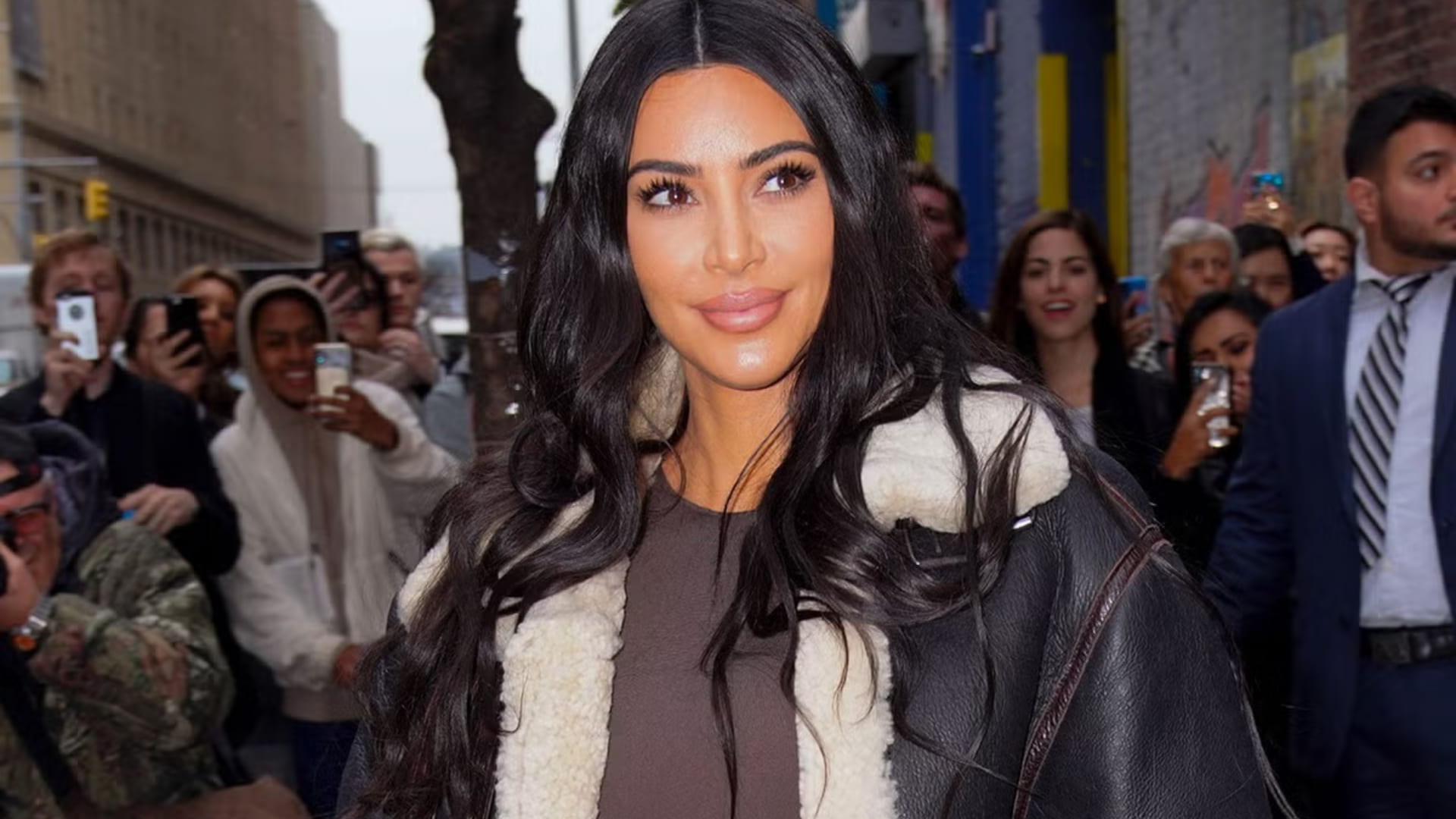 Kim Kardashian posing for fans outside an event