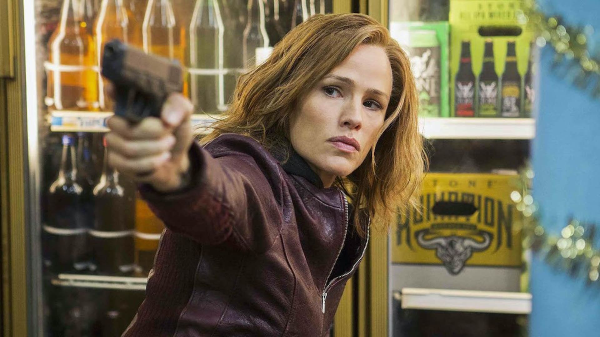 Jennifer Garner aiming handgun in store scene wearing dark leather jacket indoors