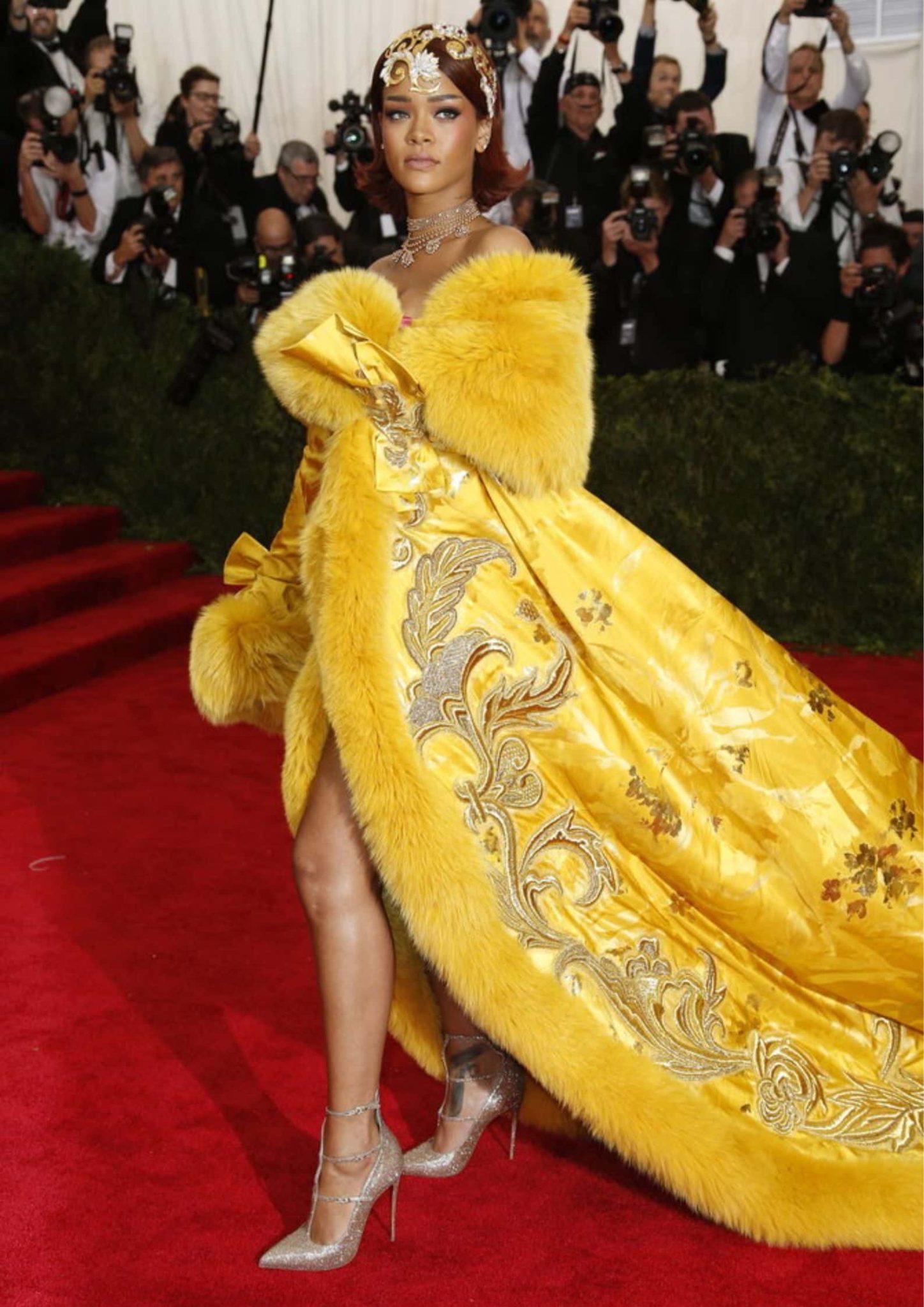 Rihanna at the 2015 Met Gala in a yellow Guo Pei coatdress with a 16-foot train.