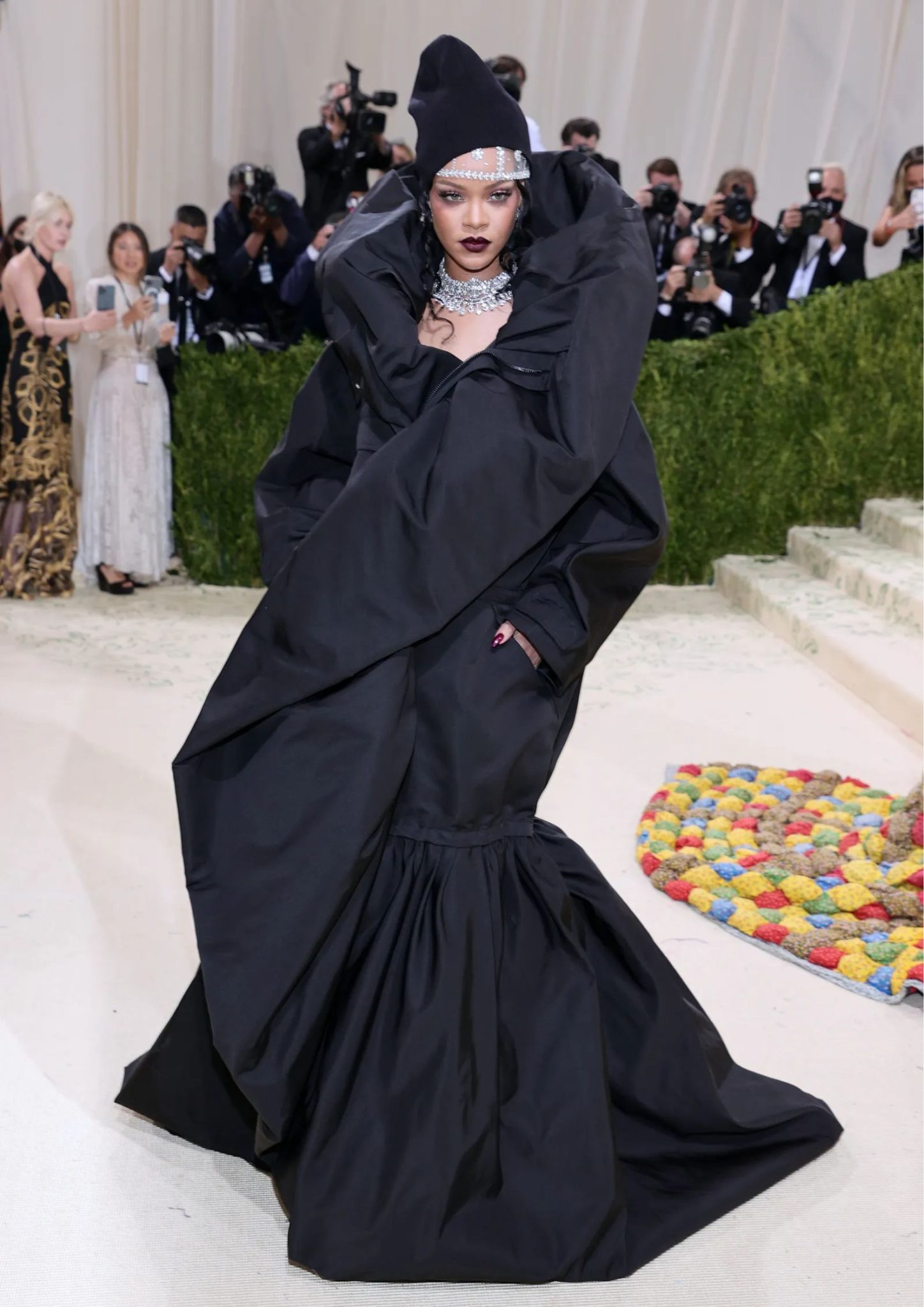 Rihanna at the 2021 Met Gala in an oversized black Balenciaga parka gown.