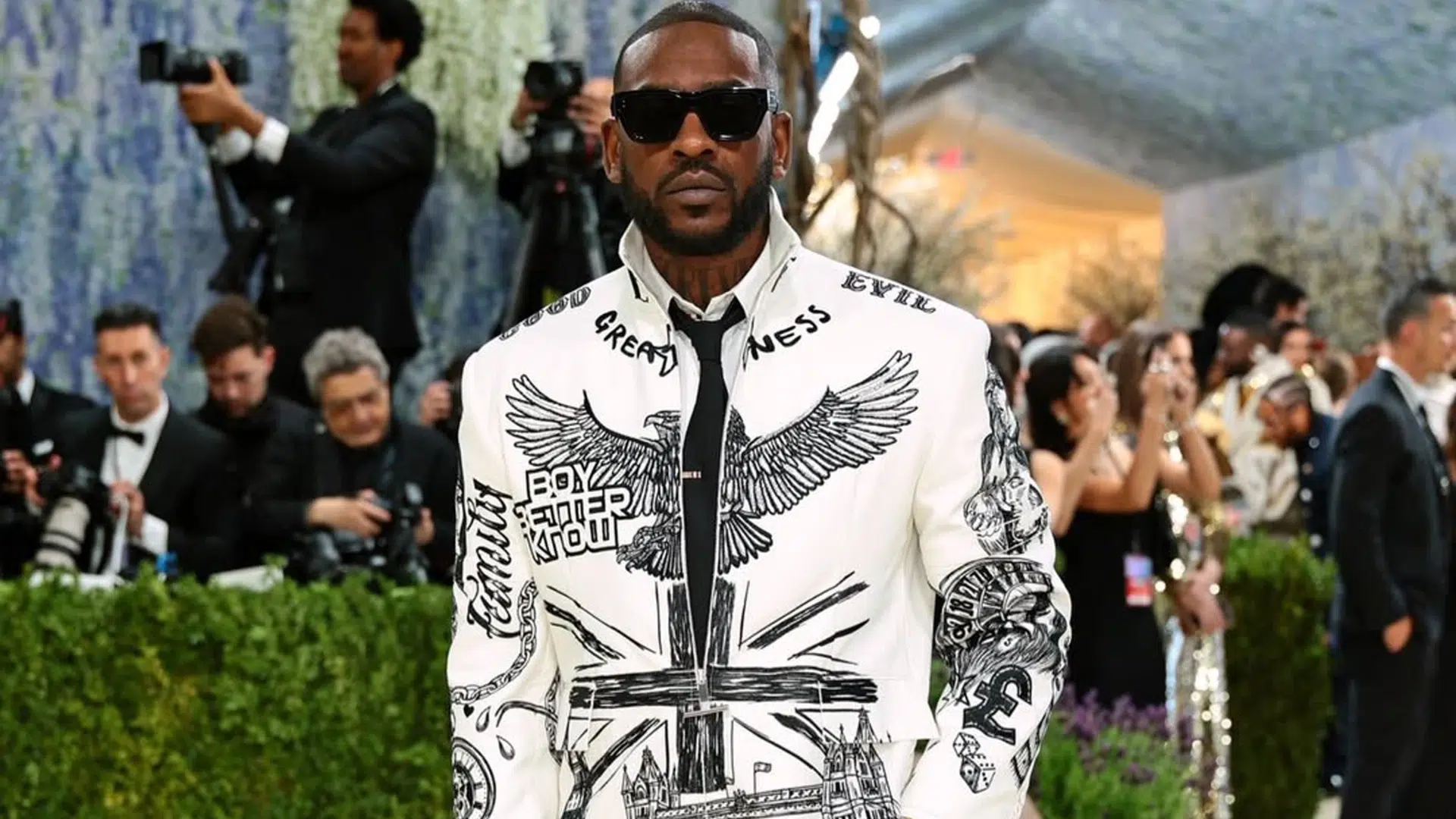 Skepta in a black and white suit
