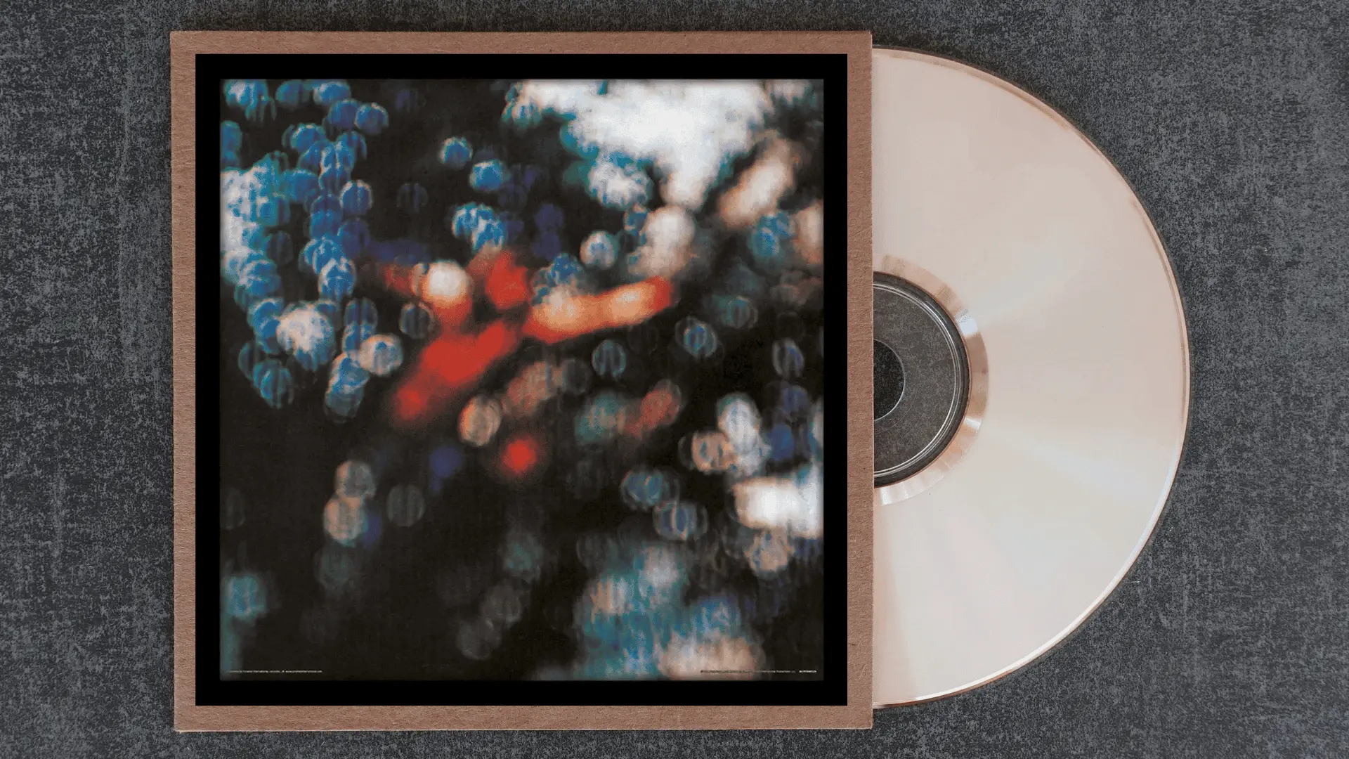 pink floyd obscured by clouds album cover with a heavily blurred abstract image of bokeh lights and colour