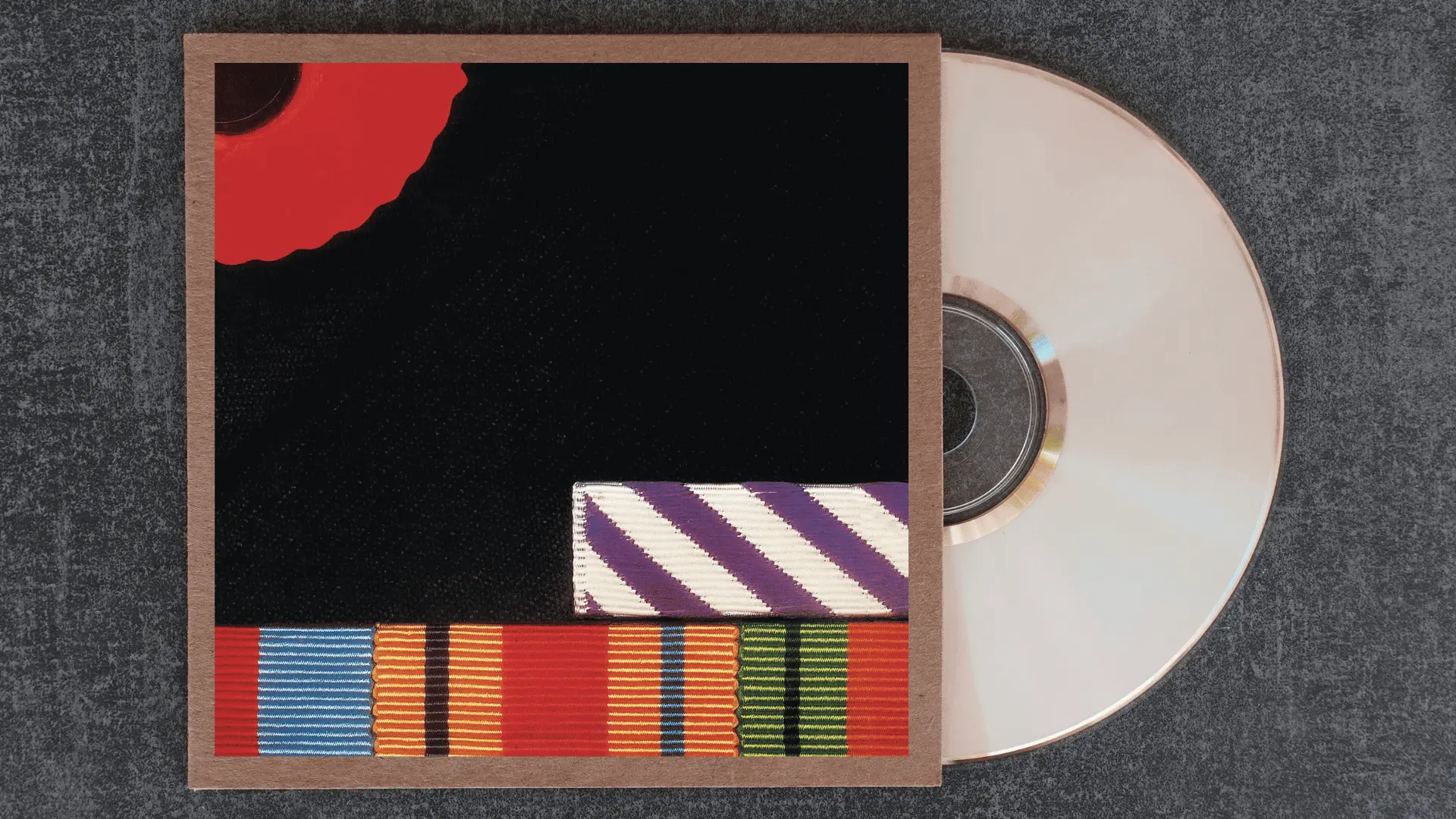 pink floyd the final cut album cover with military medal ribbons and a red poppy against a stark black background