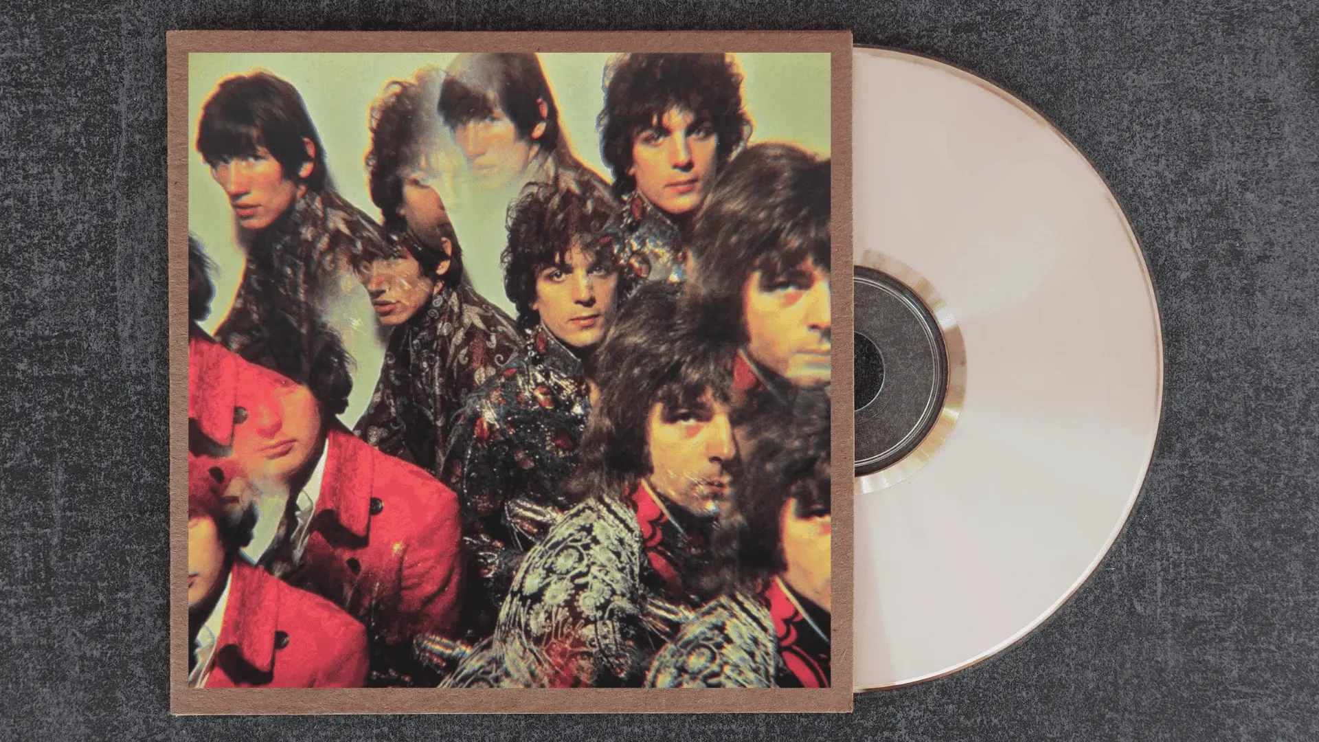 pink floyd the piper at the gates of dawn album cover with a kaleidoscopic prism portrait of the band in psychedelic clothing