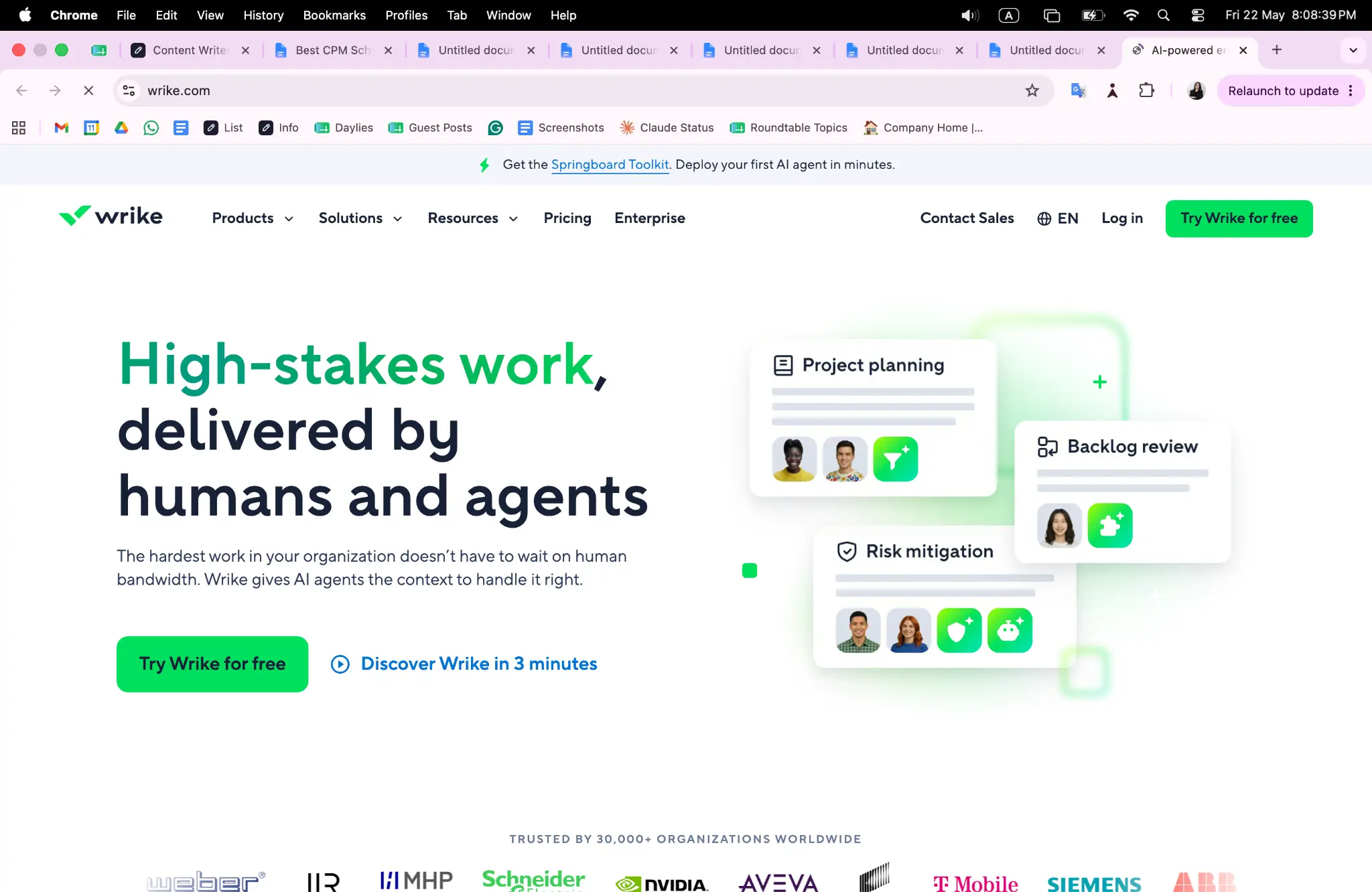 Wrike website homepage with project planning and backlog review interface elements displayed