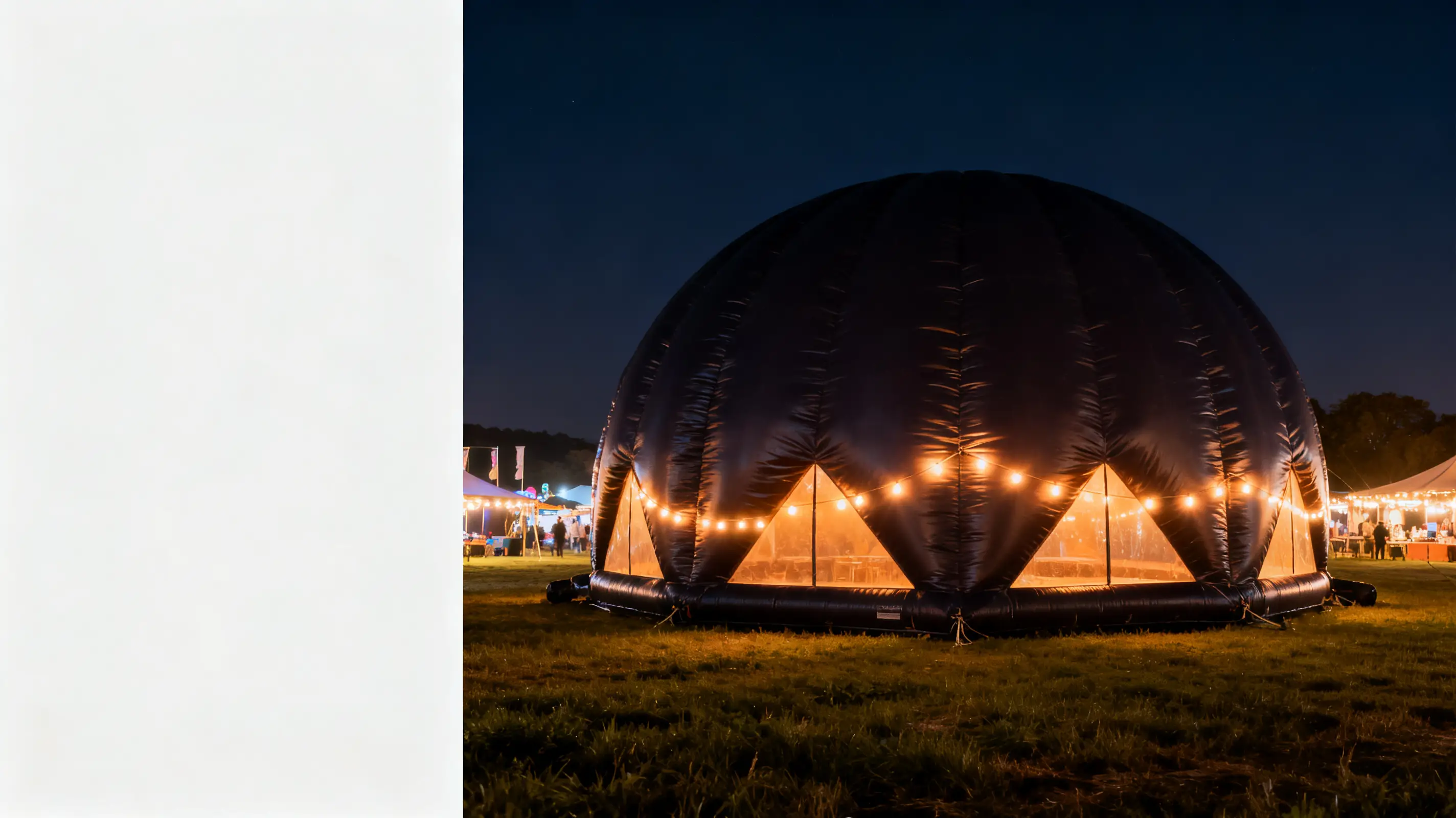 Dome-shaped inflatable tent illuminated with string lights at nighttime outdoor event