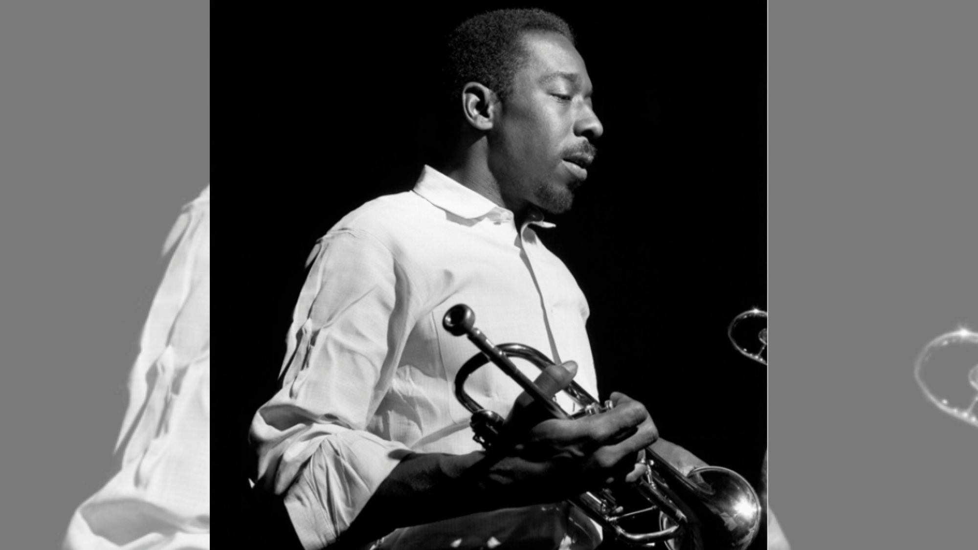 blue mitchell sitting with trumpet during a reflective hard-bop jazz portrait session