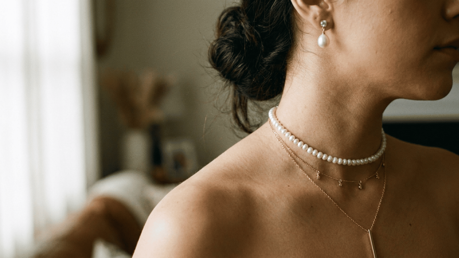 Delicate layered necklaces add a soft, romantic touch to bridal and bridesmaid