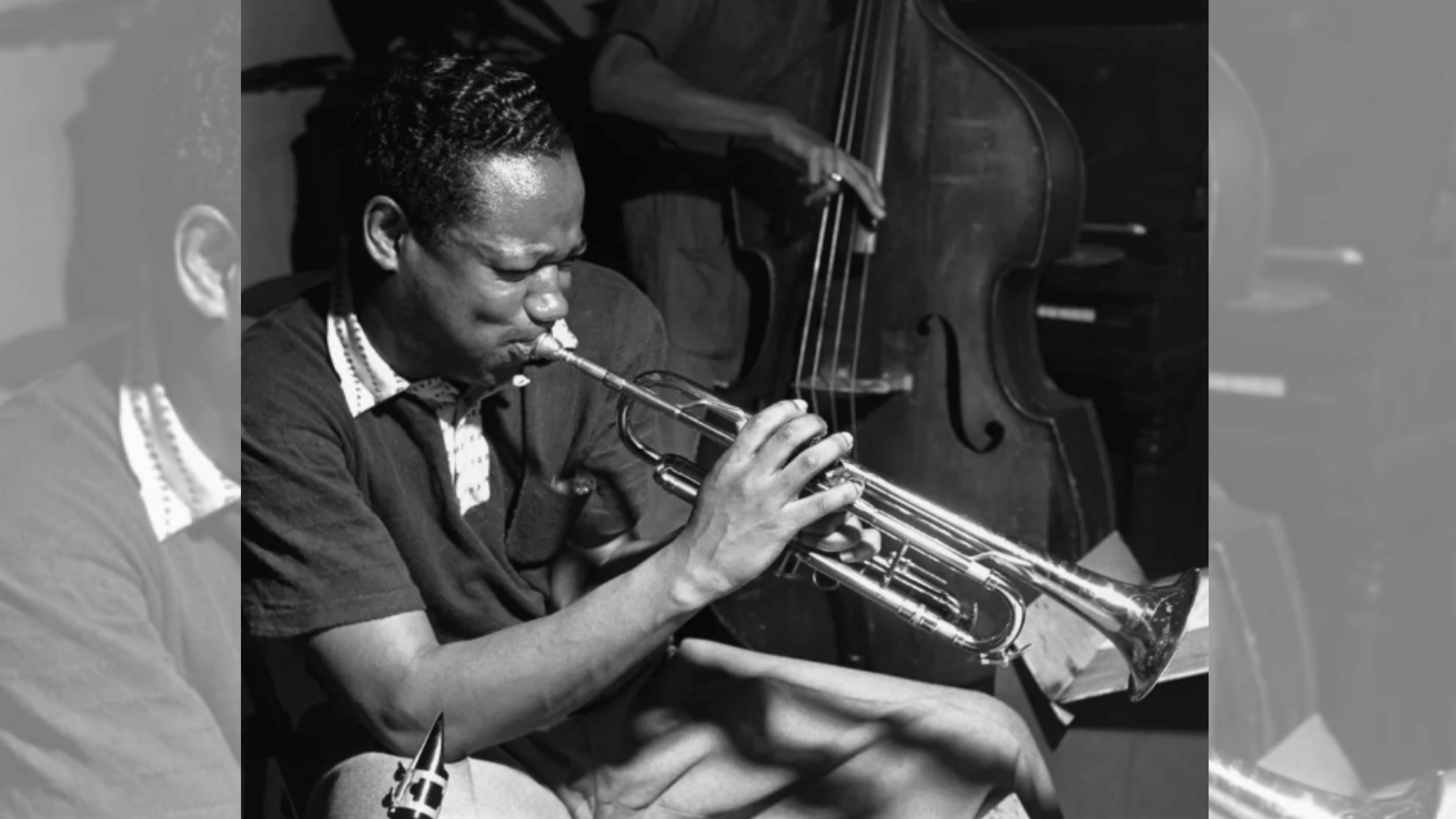 clifford brown performing trumpet beside a bassist during a live jazz rehearsal