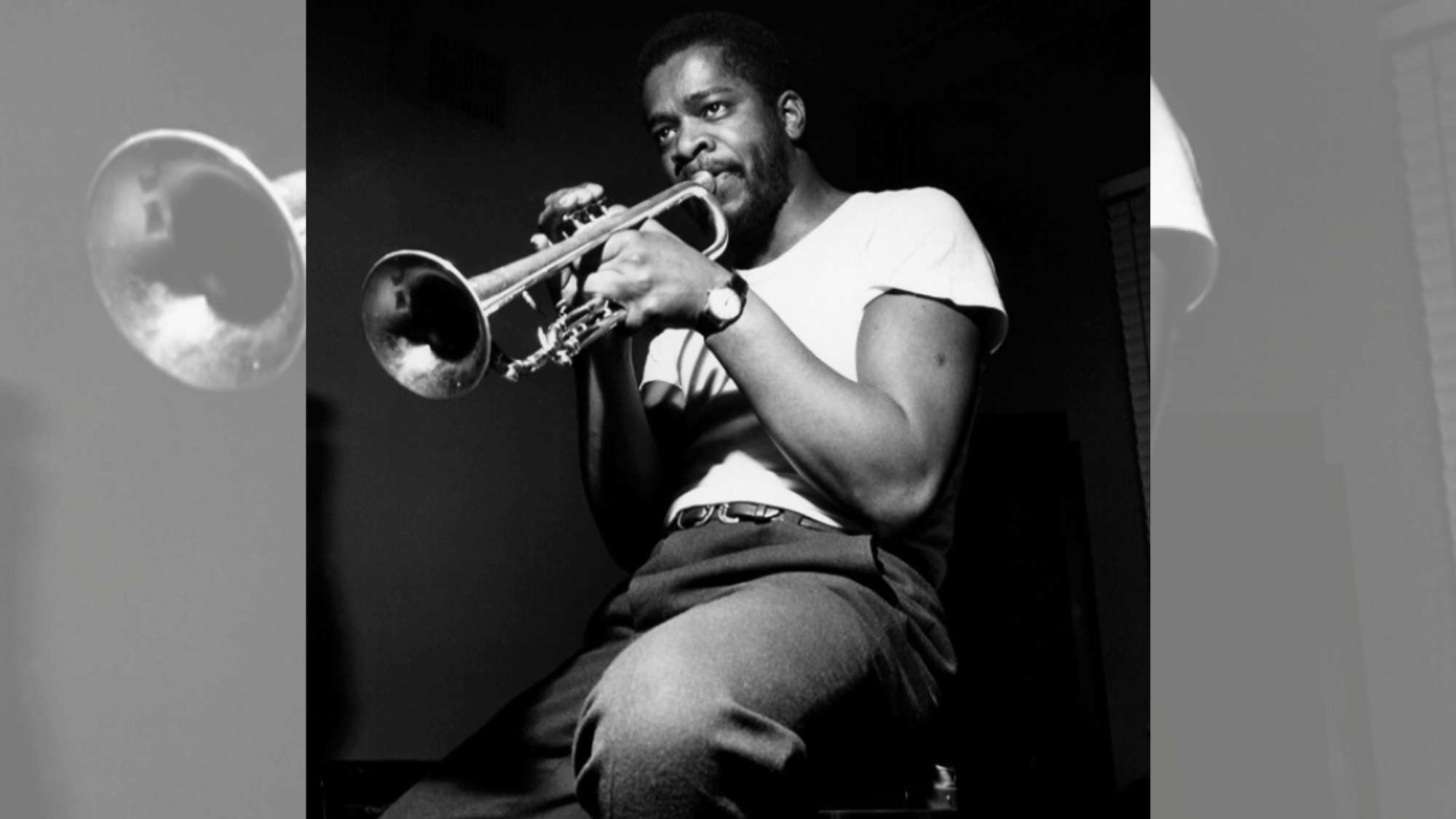 donald byrd performing trumpet during a dramatic black and white jazz session
