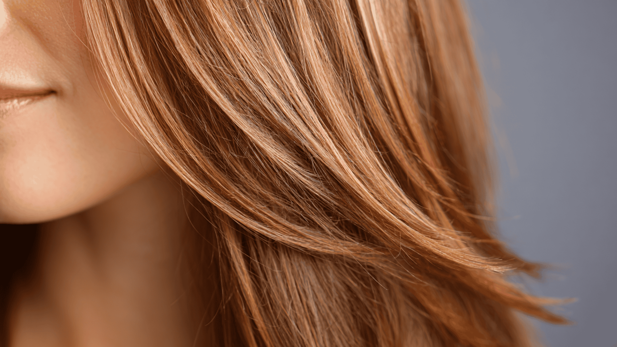 Fine hair being trimmed with scissors by a stylist