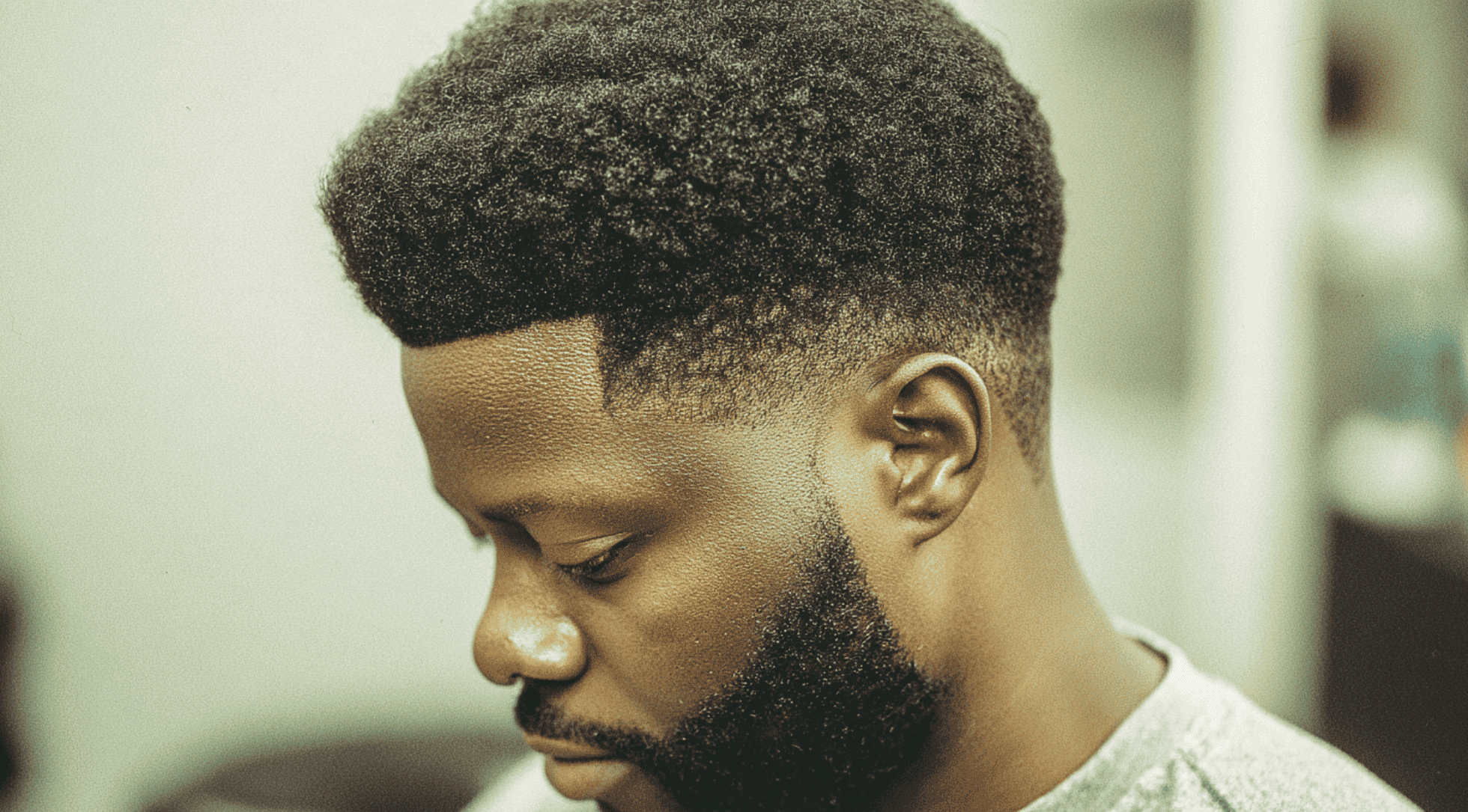 Mid fade black men full natural afro round shape sharp edges temple fade clean sides portrait