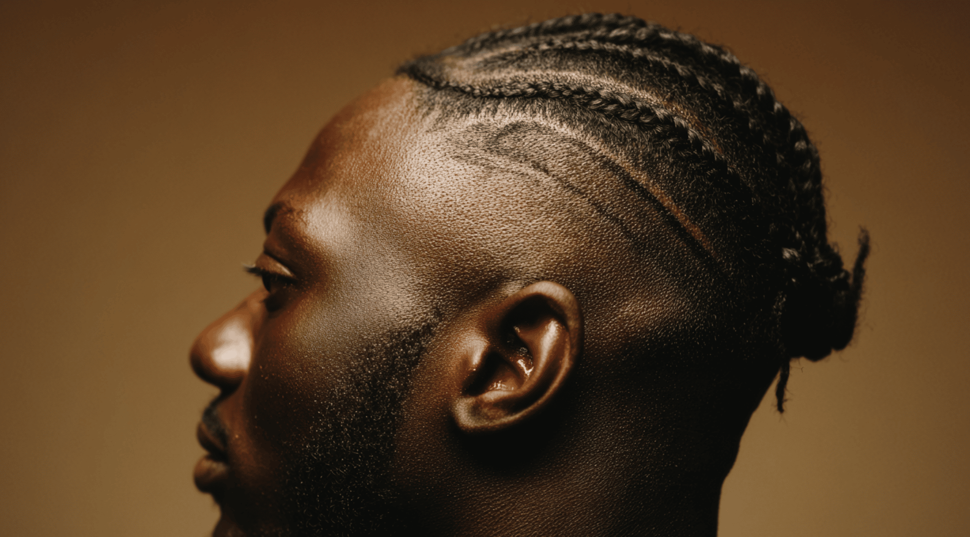 Drop fade black men cornrows braids curved line behind ear sharp line up portrait