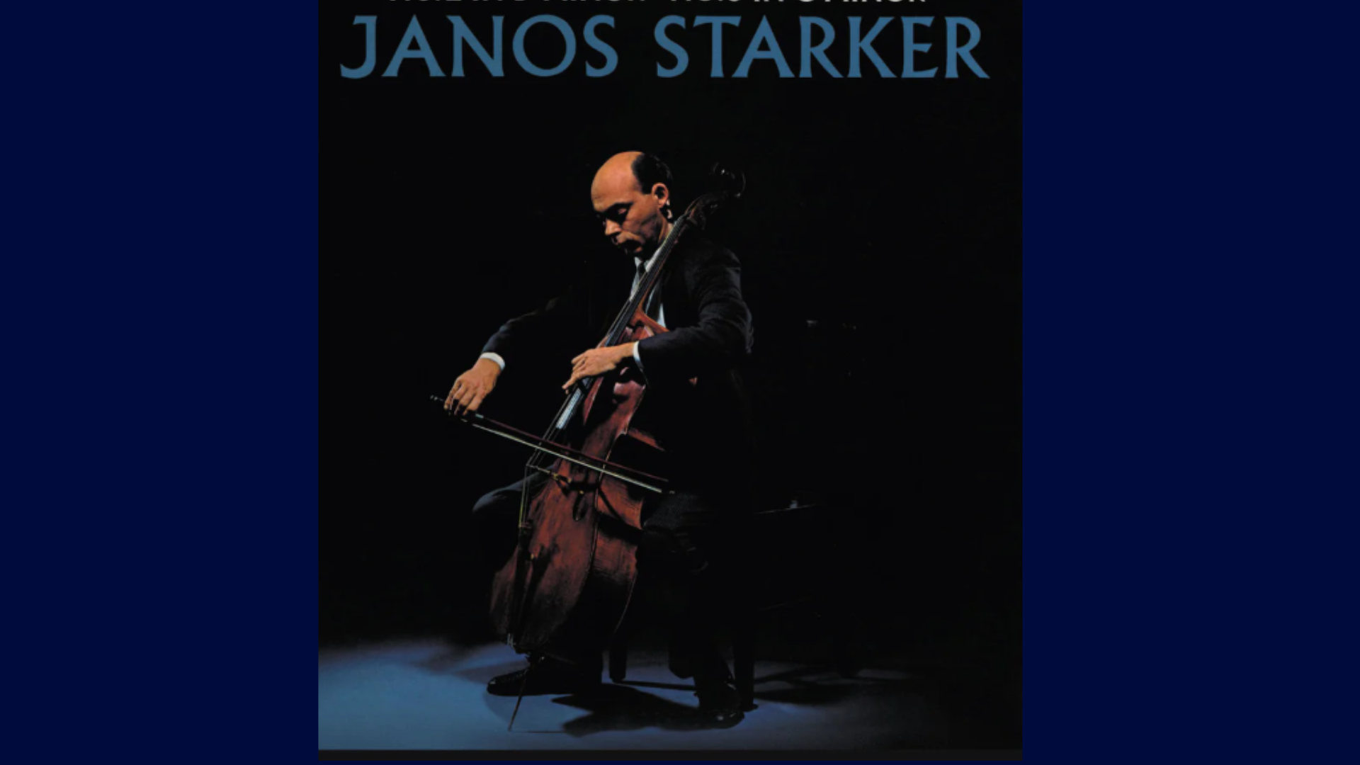 János Starker performing cello during a classical concert with focused expression and elegant stage setting.