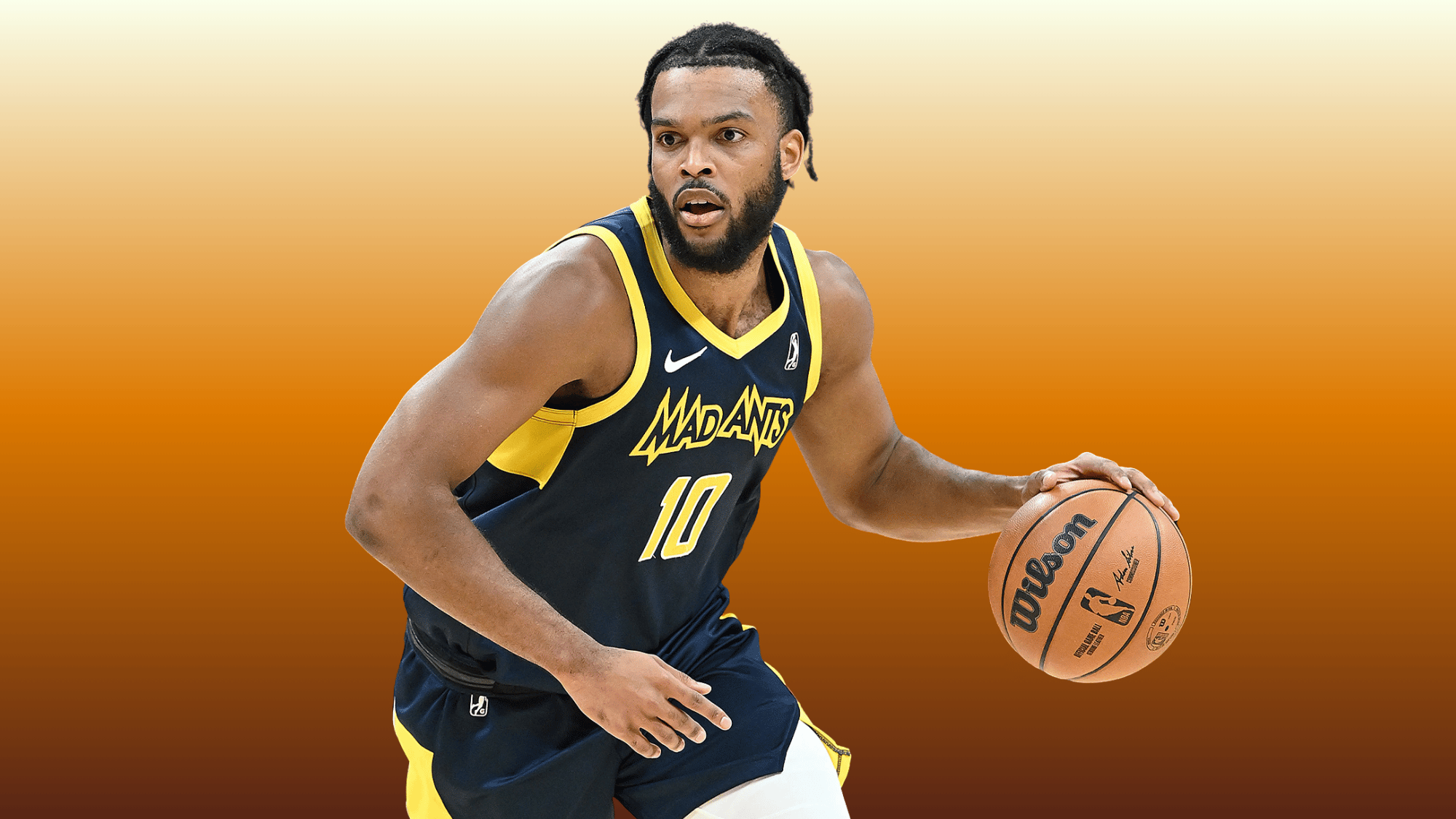 Josiah James dribbles in Mad Ants jersey number 10 on orange background