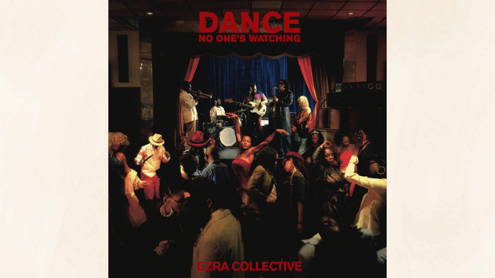 live jazz performance scene with dancing crowd gathered around band on warmly lit nightclub stage indoors