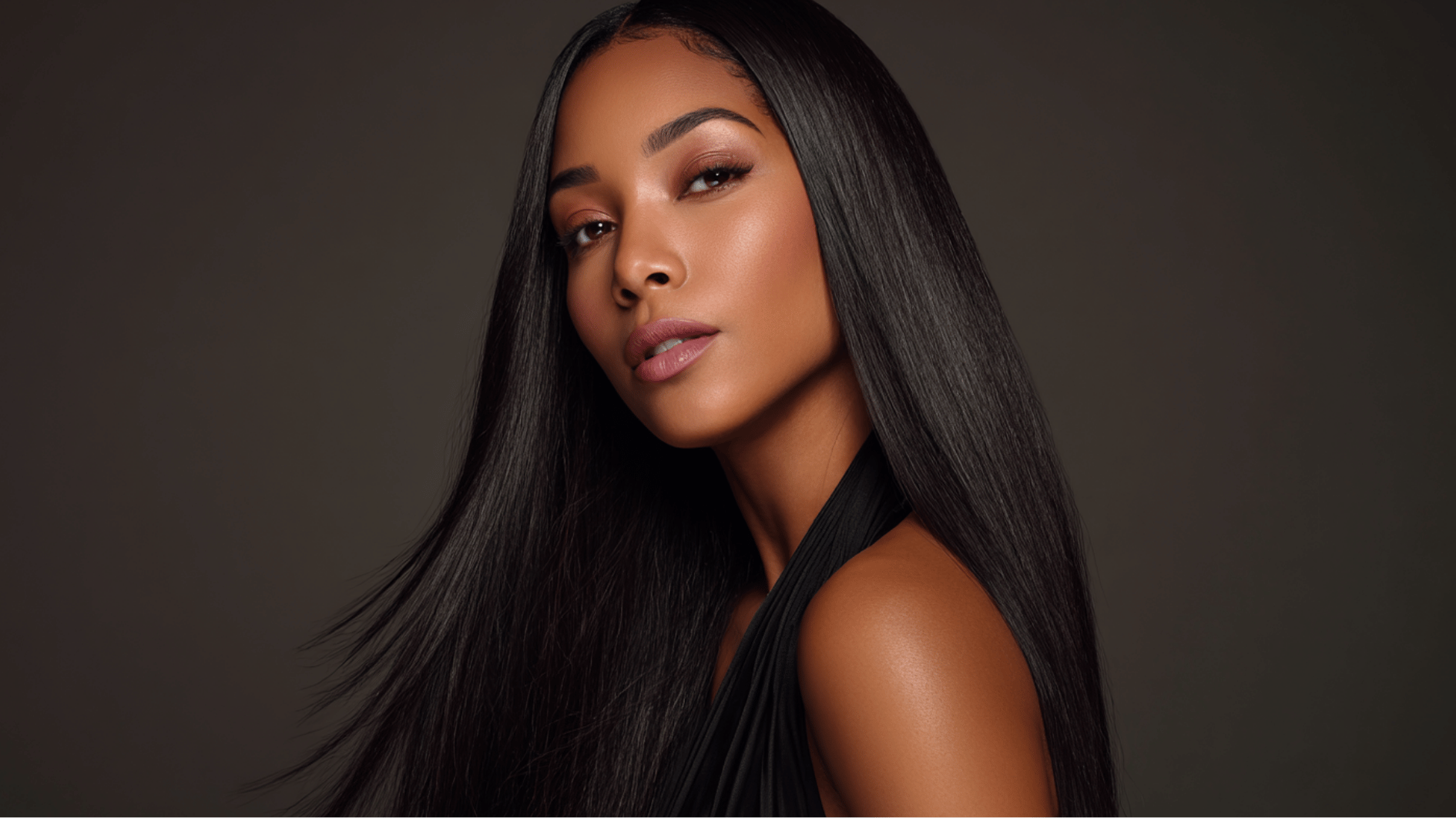 middle part straight sew-in with sleek hair and symmetrical styling