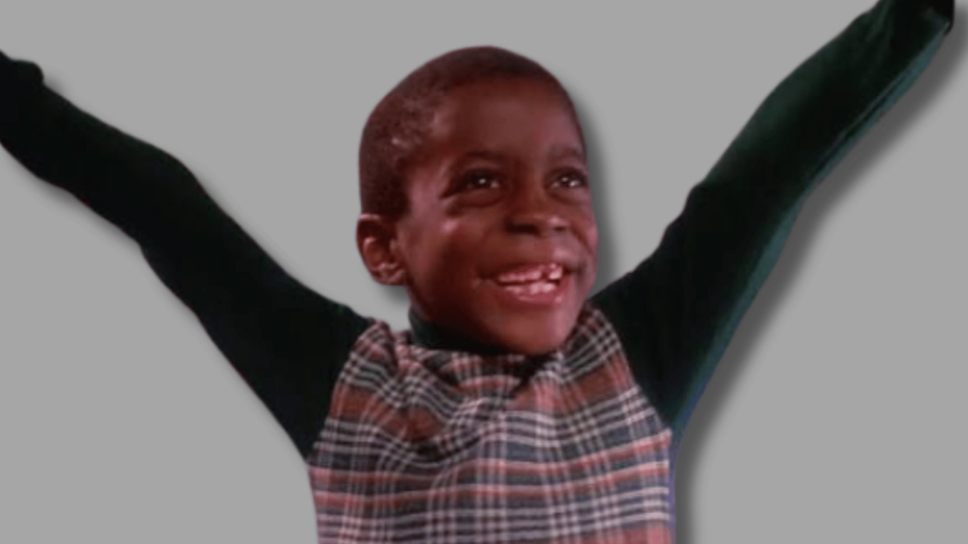 neatly made hotel style young eddie murphy smiling with raised arms during a childhood scene from an early television appearance