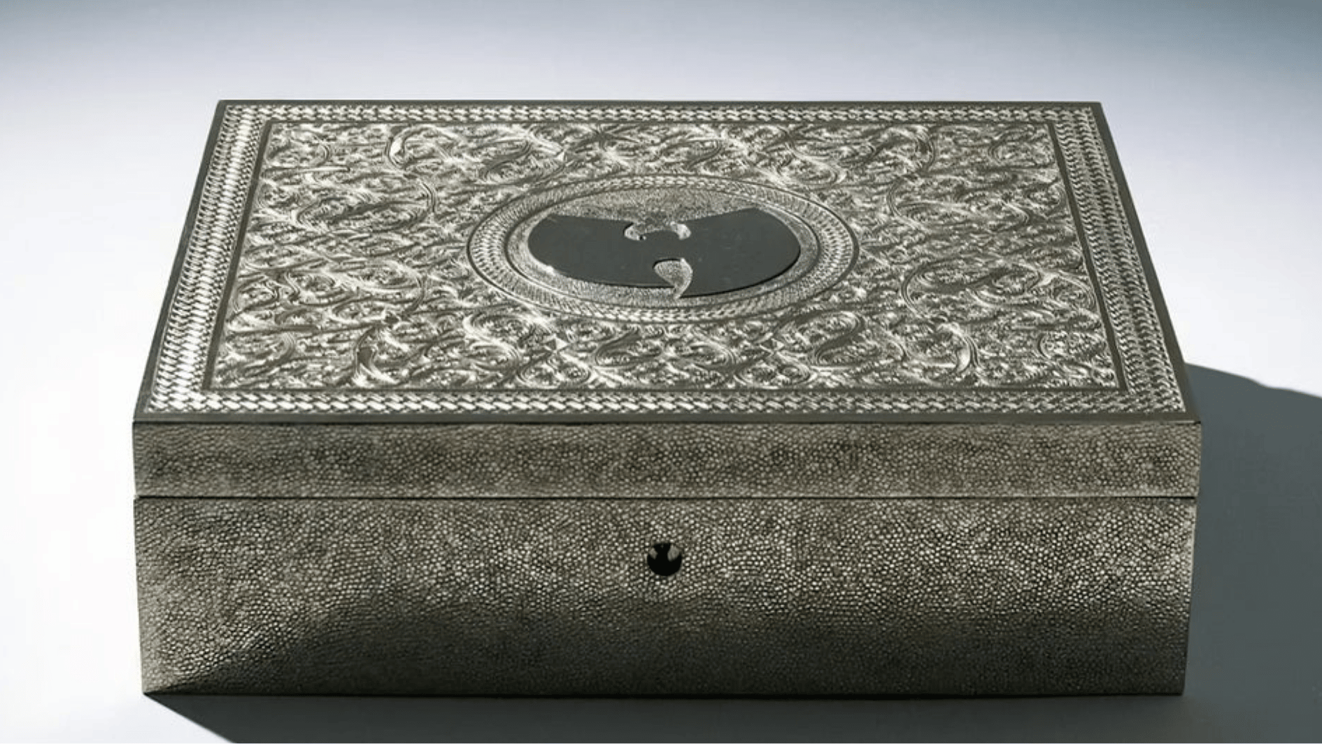 silver engraved collector's box featuring the wu-tang clan logo, housing the rare once upon a time in shaolin album