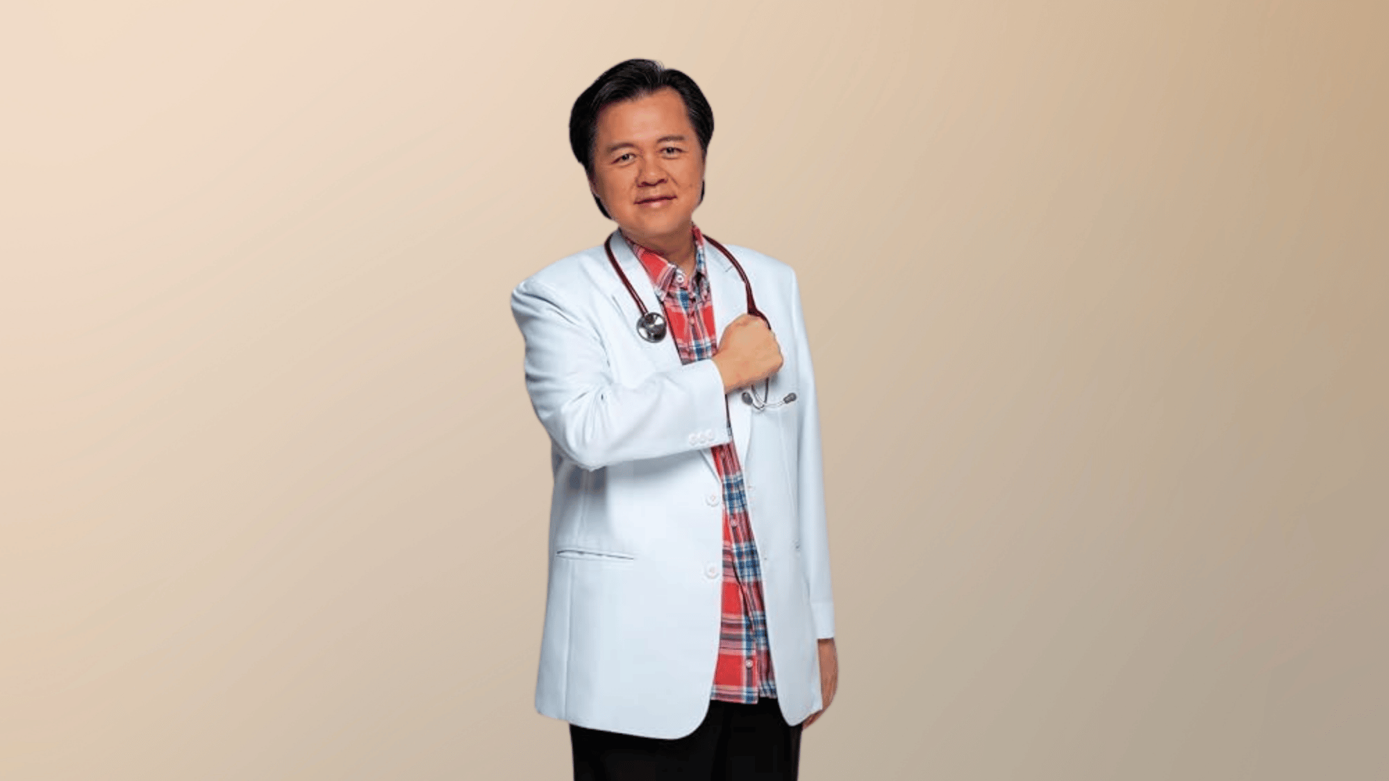 Senator Willie Ong speaking at a podium in white blazer during an official public event in Philippines