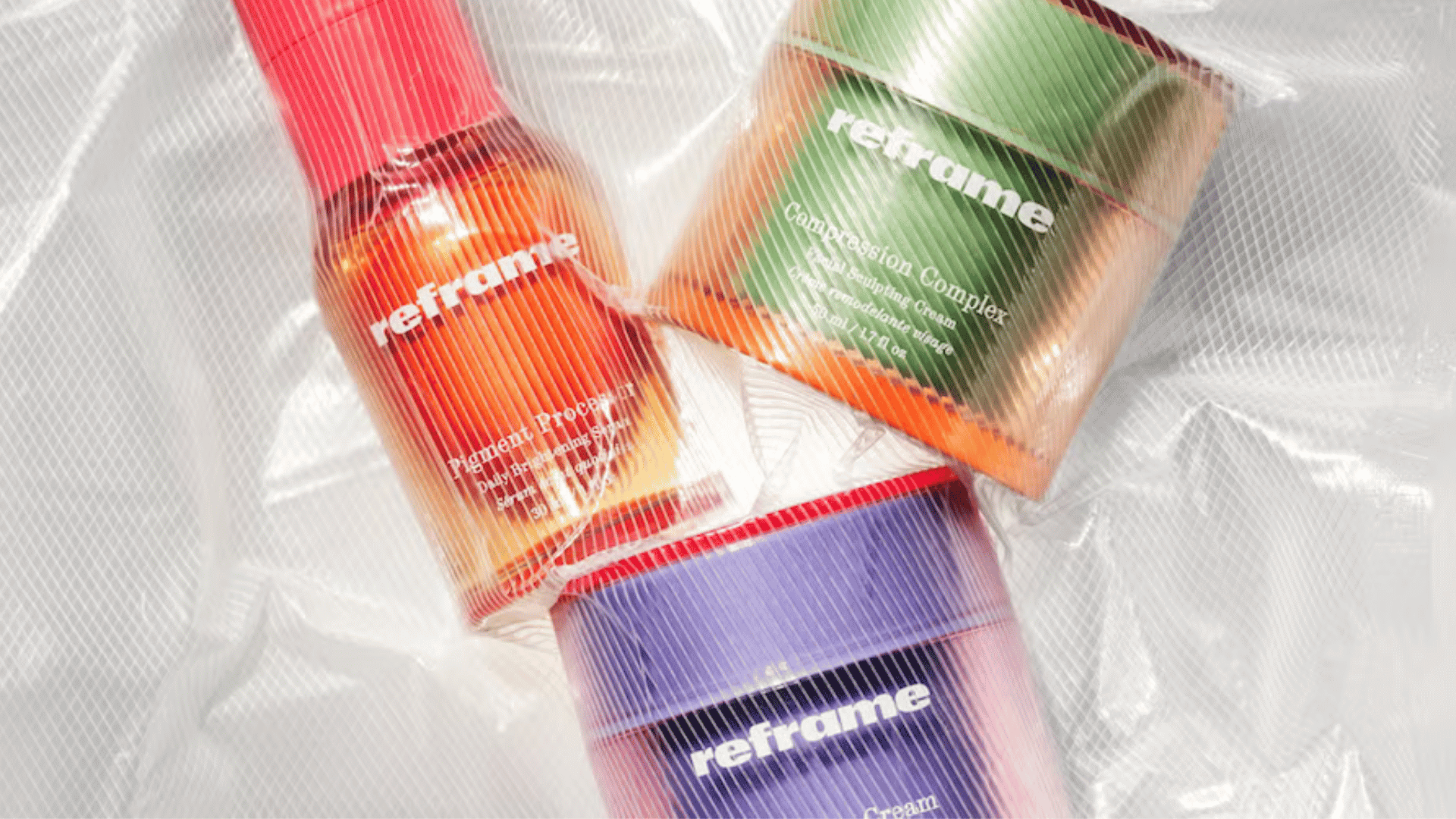 Reframe beauty skincare products wrapped in clear plastic packaging