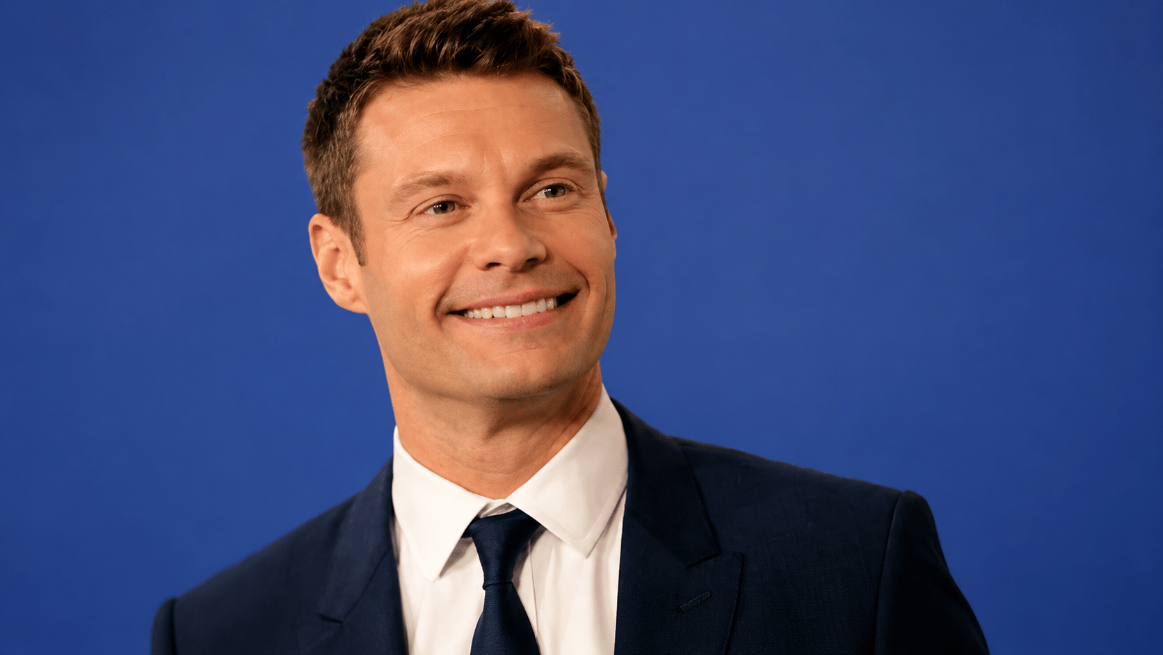 Professional media host Ryan Seacrest symbolizing earnings from TV, radio, and business ventures