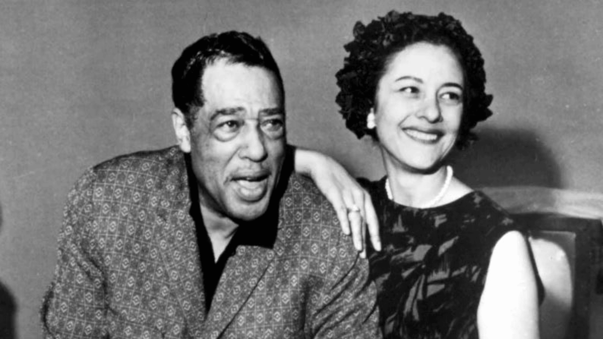 Duke Ellington Satin Doll era candid portrait with woman black and white vintage archival photograph