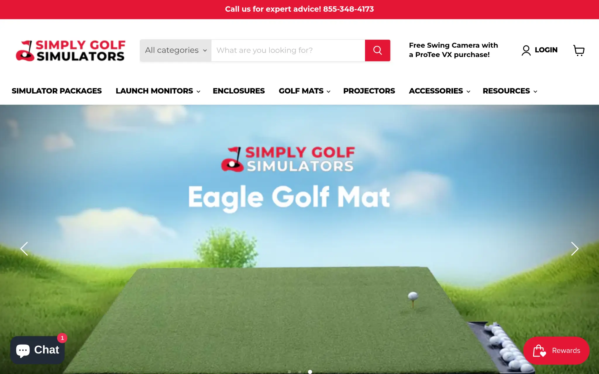 Golf mat with tee and balls on simulated grass under blue sky