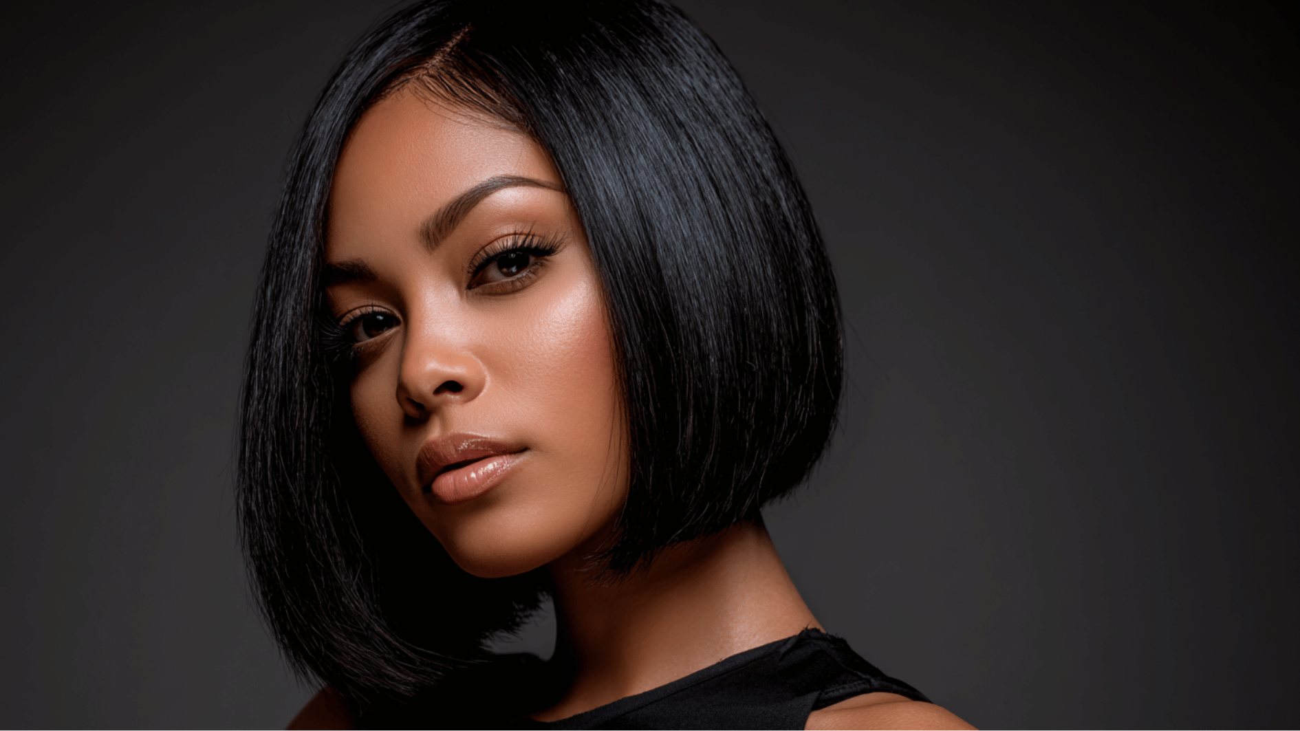 sleek bob sew-in hairstyle with smooth straight hair and polished salon finish