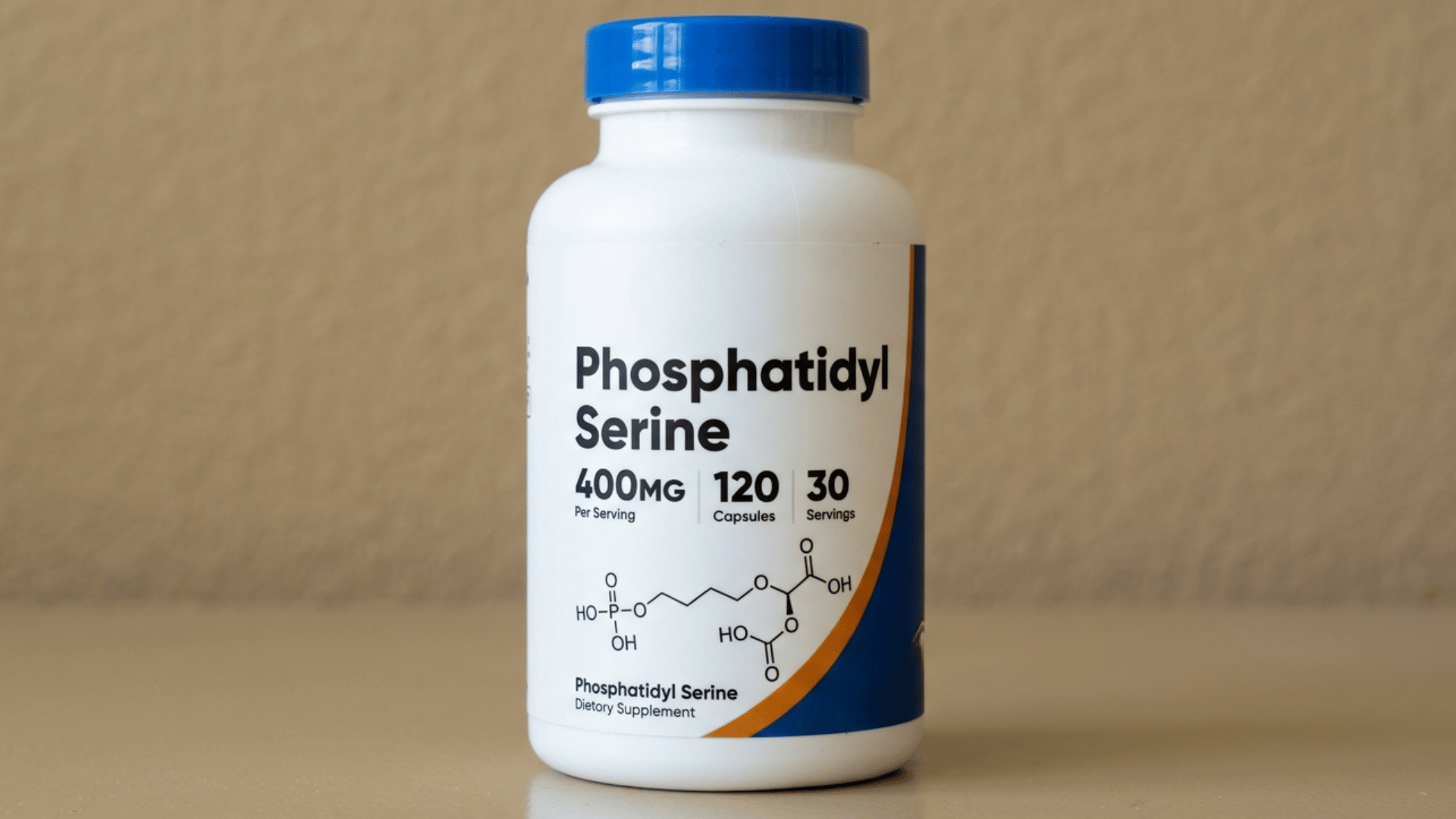 A white bottle of Phosphatidyl Serine 400mg capsules with a blue cap against a beige background