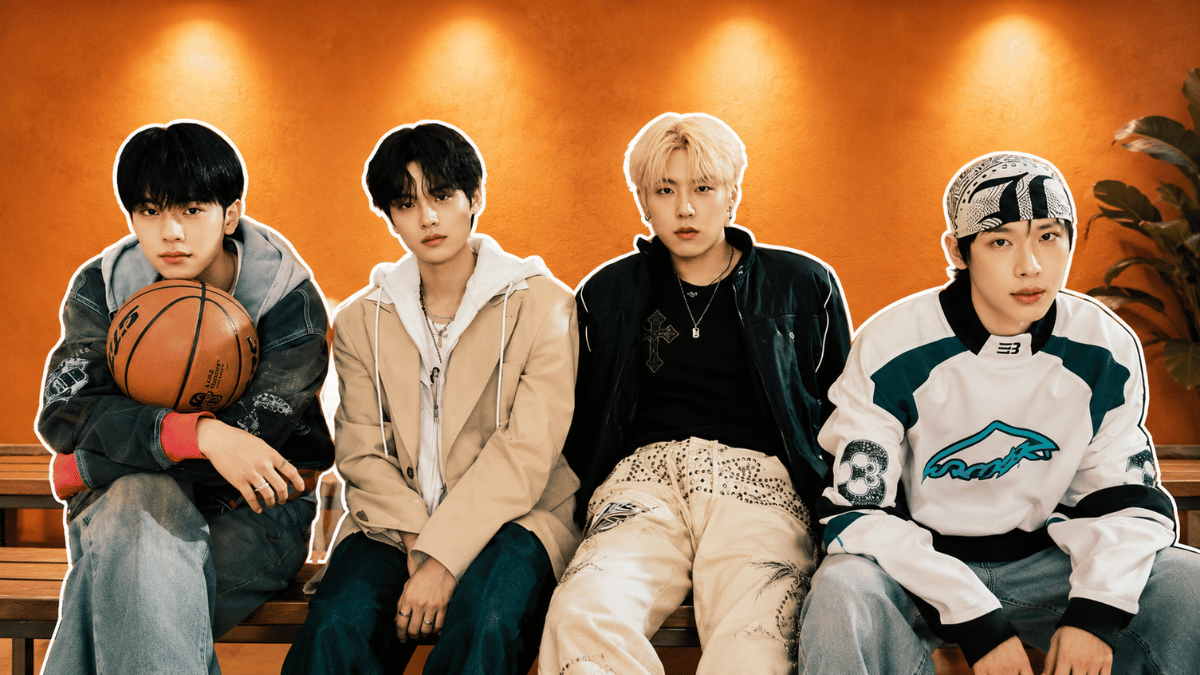 AB6IX members posing on a bench in a modern studio setting