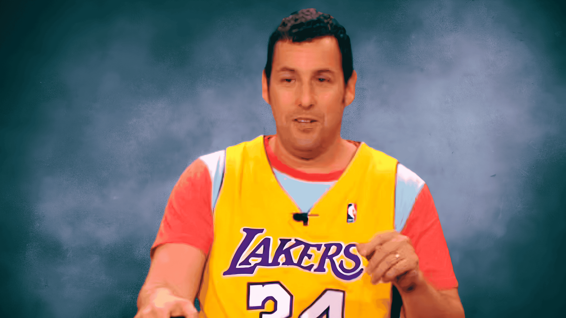 Man wearing a yellow Lakers basketball jersey over a coral t-shirt