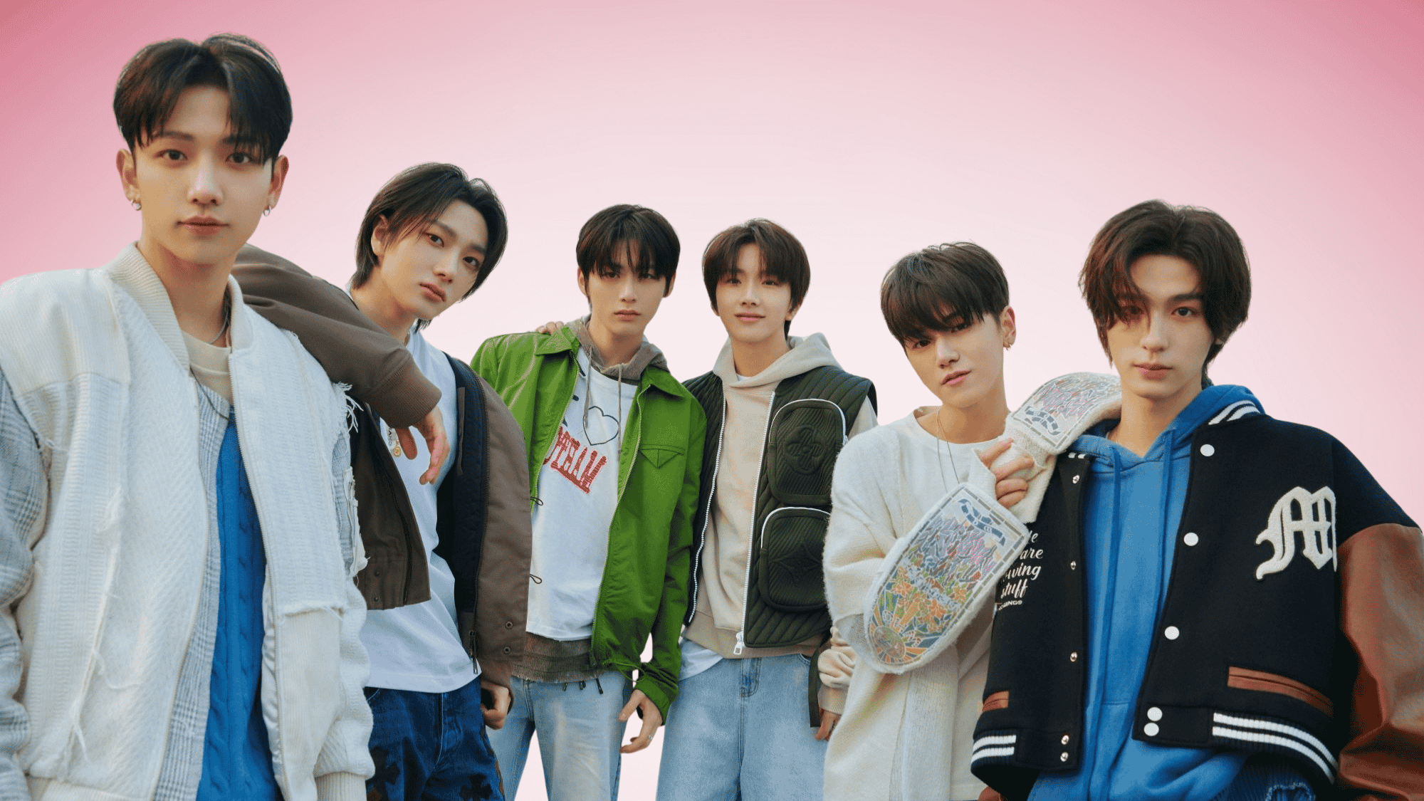 BOYNEXTDOOR members posing together in casual outfits against a pink background during a promotional group photoshoot.