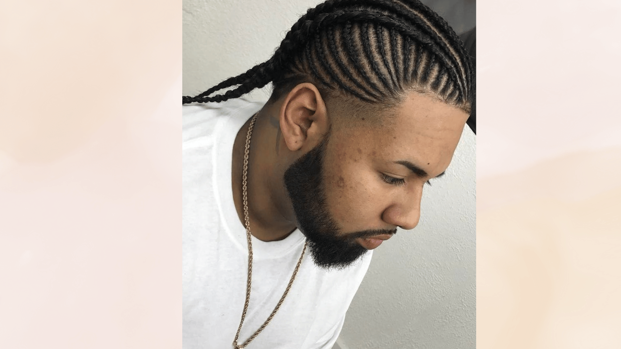 braided mohawk hairstyle with neat cornrows and faded sides creating a stylish protective hair look