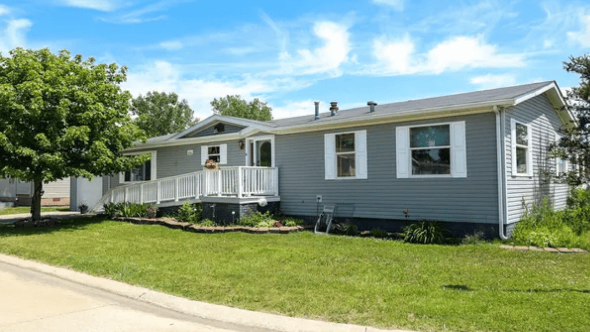cedarbrook estates manufactured home with lawn and outdoor space in white lake michigan community setting