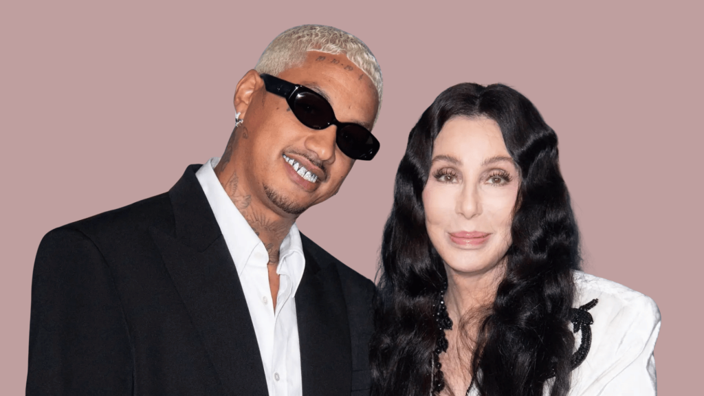 Singer laughing beside her partner during a studio-style photo moment