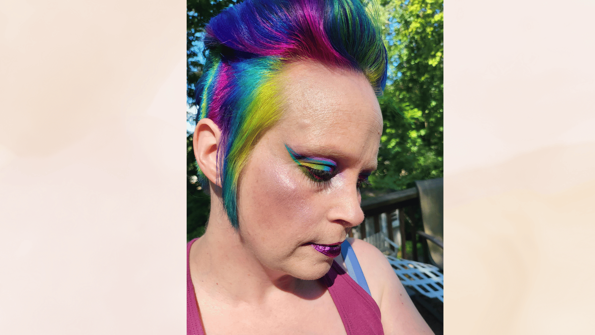 colored mohawk haircut with vibrant multicolor hair and shaved sides creating a bold fashionable statement look