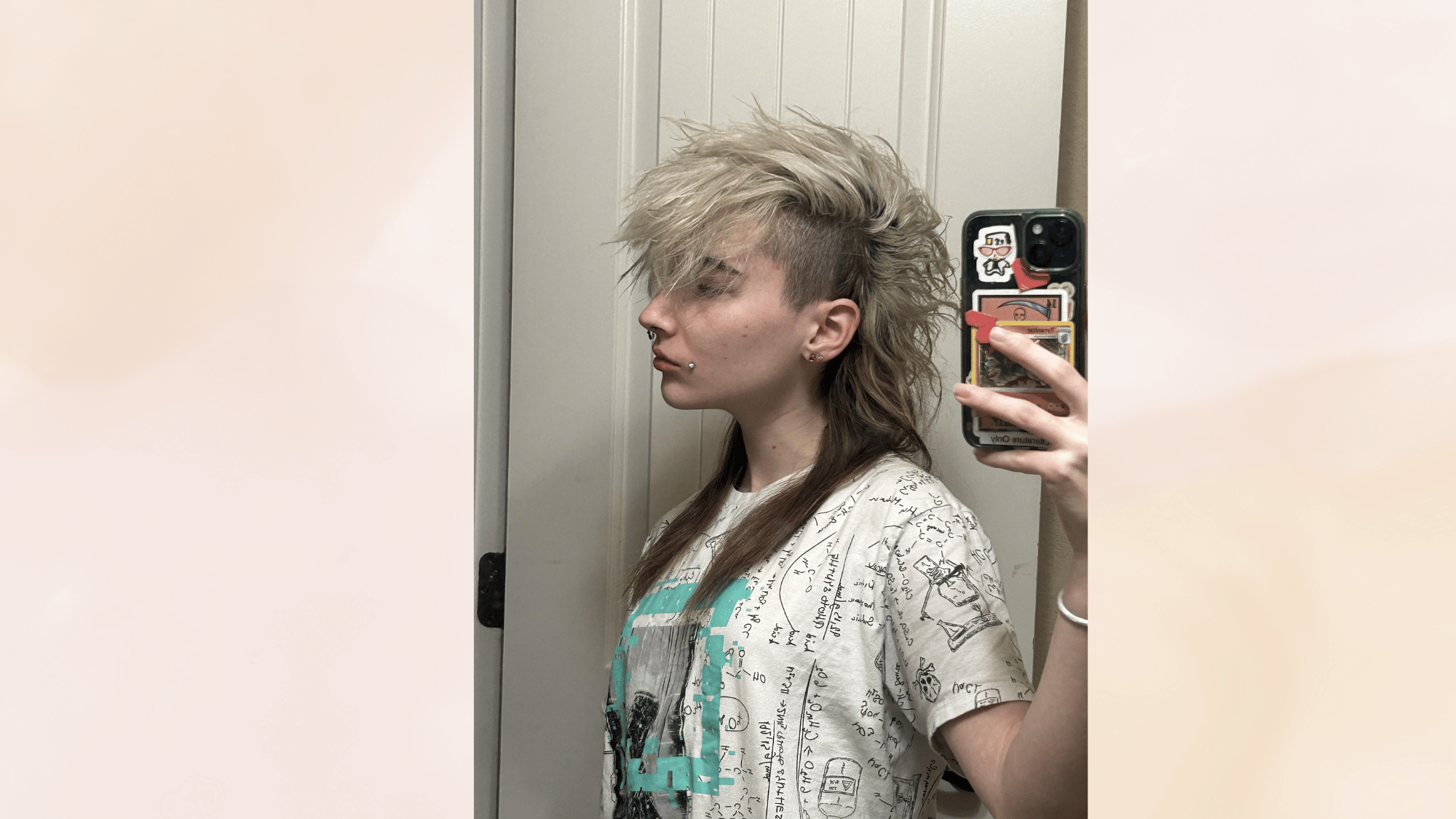 deathhawk hairstyle with dramatic teased volume shaved sides and gothic inspired edgy alternative look