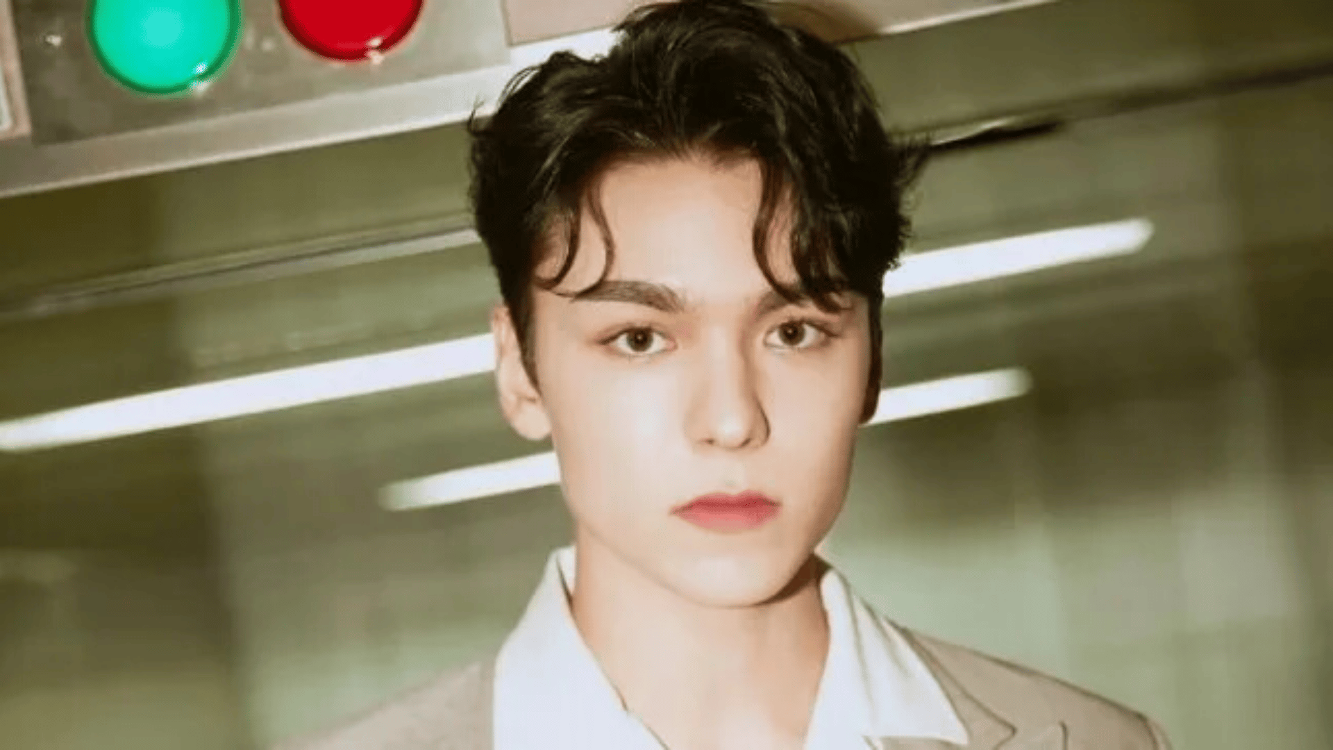 Dino of seventeen posing for a portrait photo showcasing his youthful style