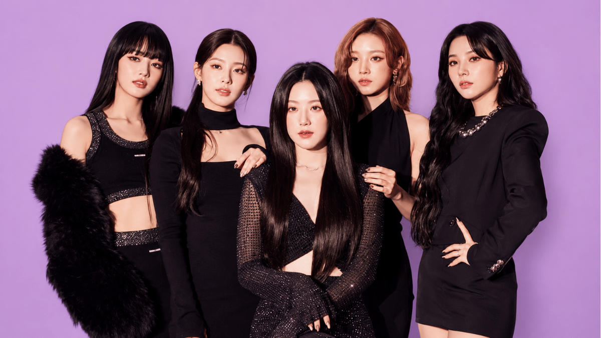 gidlle members posing in elegant black outfits on a pastel purple background
