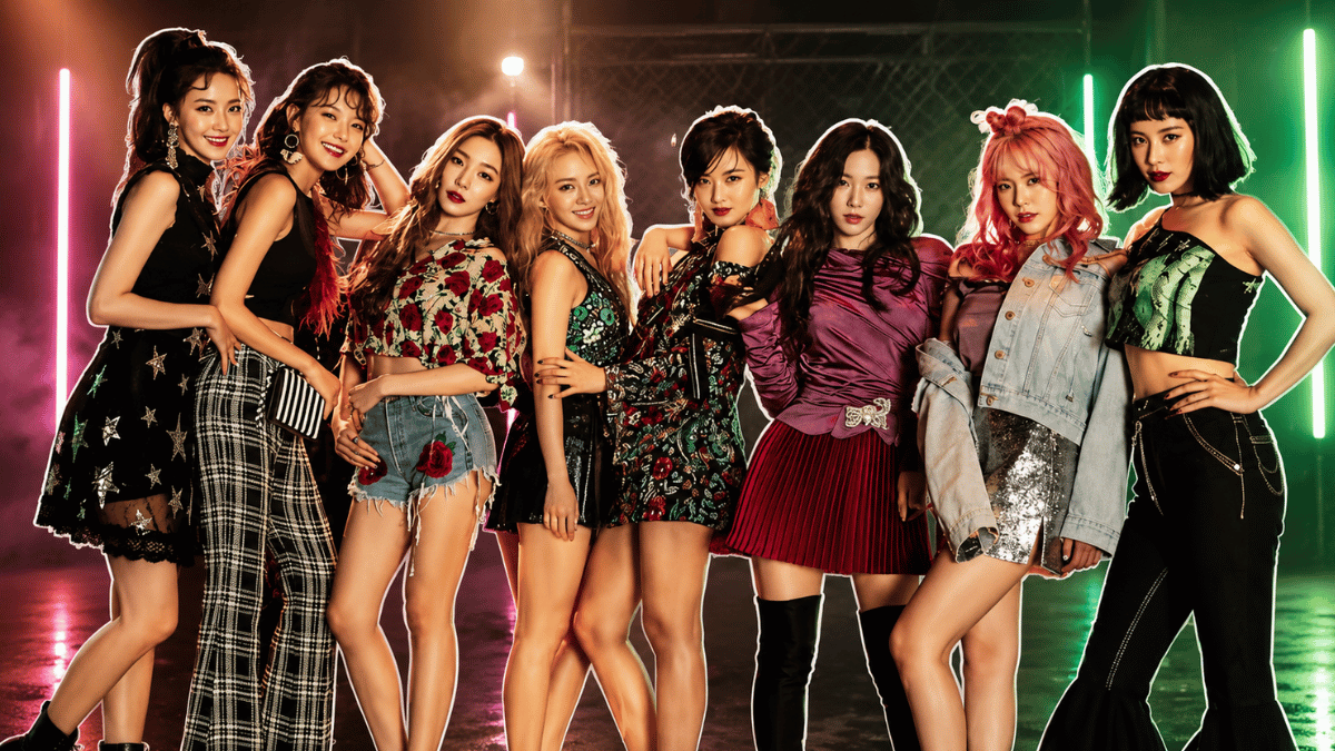 Girls' Generation members posing in colorful outfits