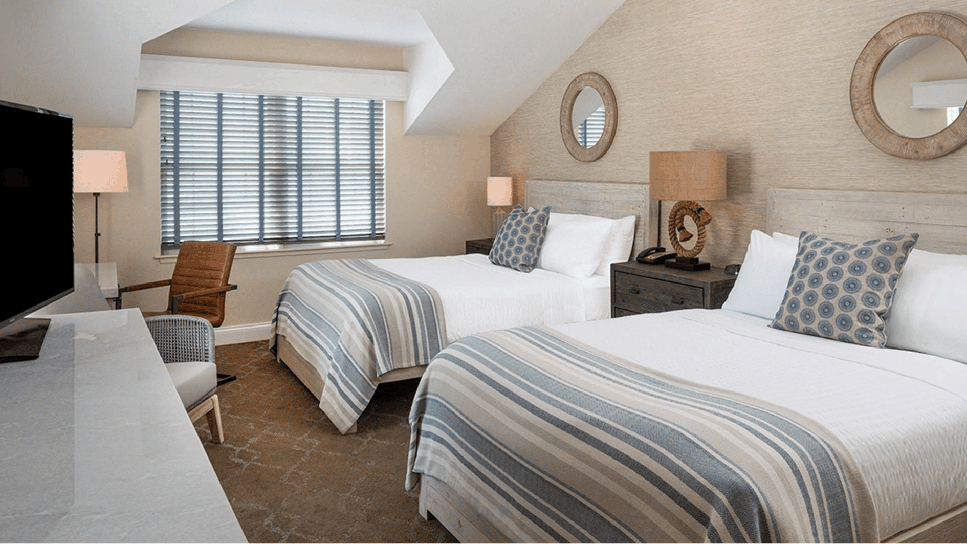 guest bedrooms in obama martha vineyard home with twin beds striped bedding neutral decor mirrors and soft lighting design