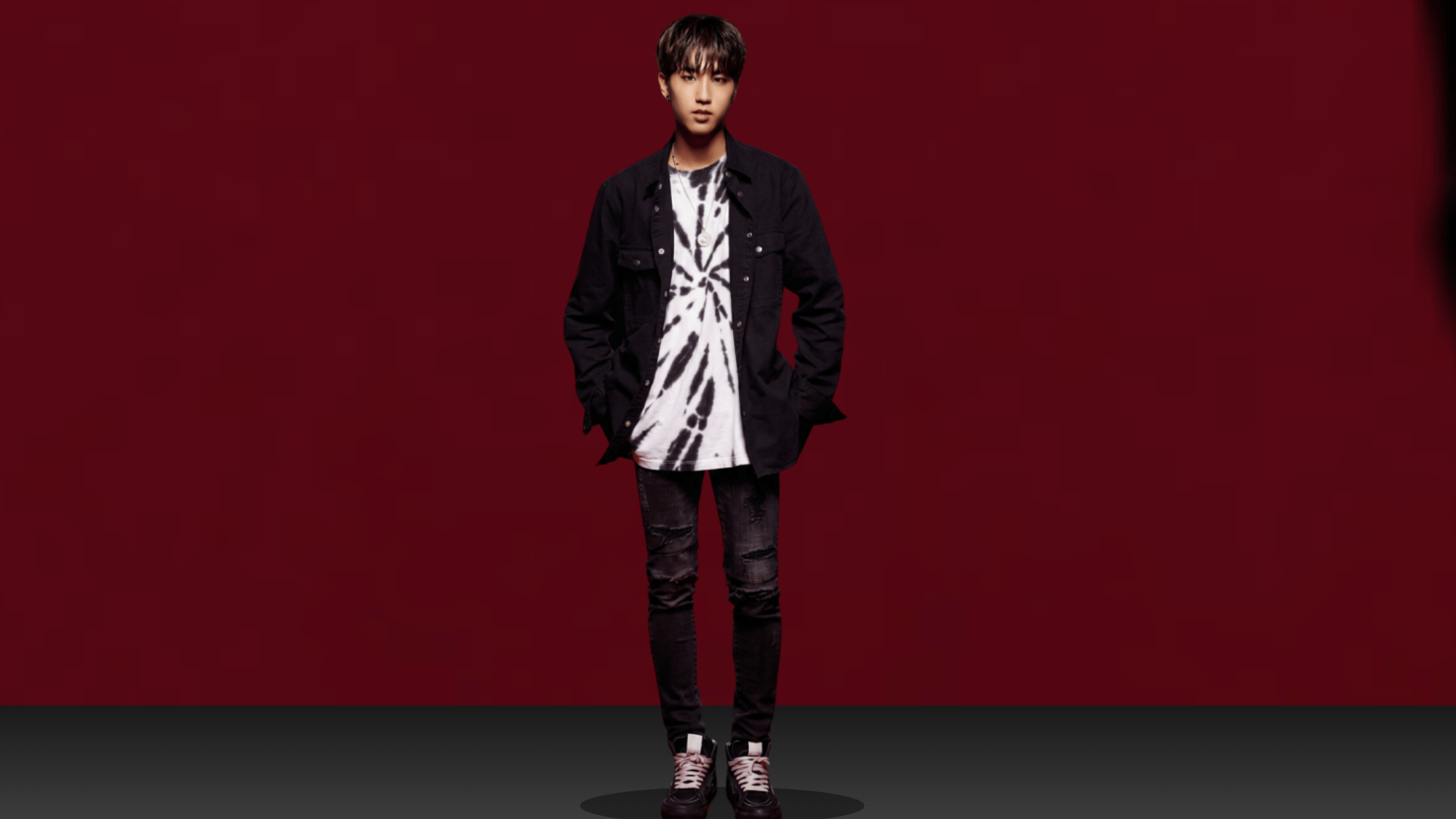 A photo of Stray Kids member Han Jisung posing individually.